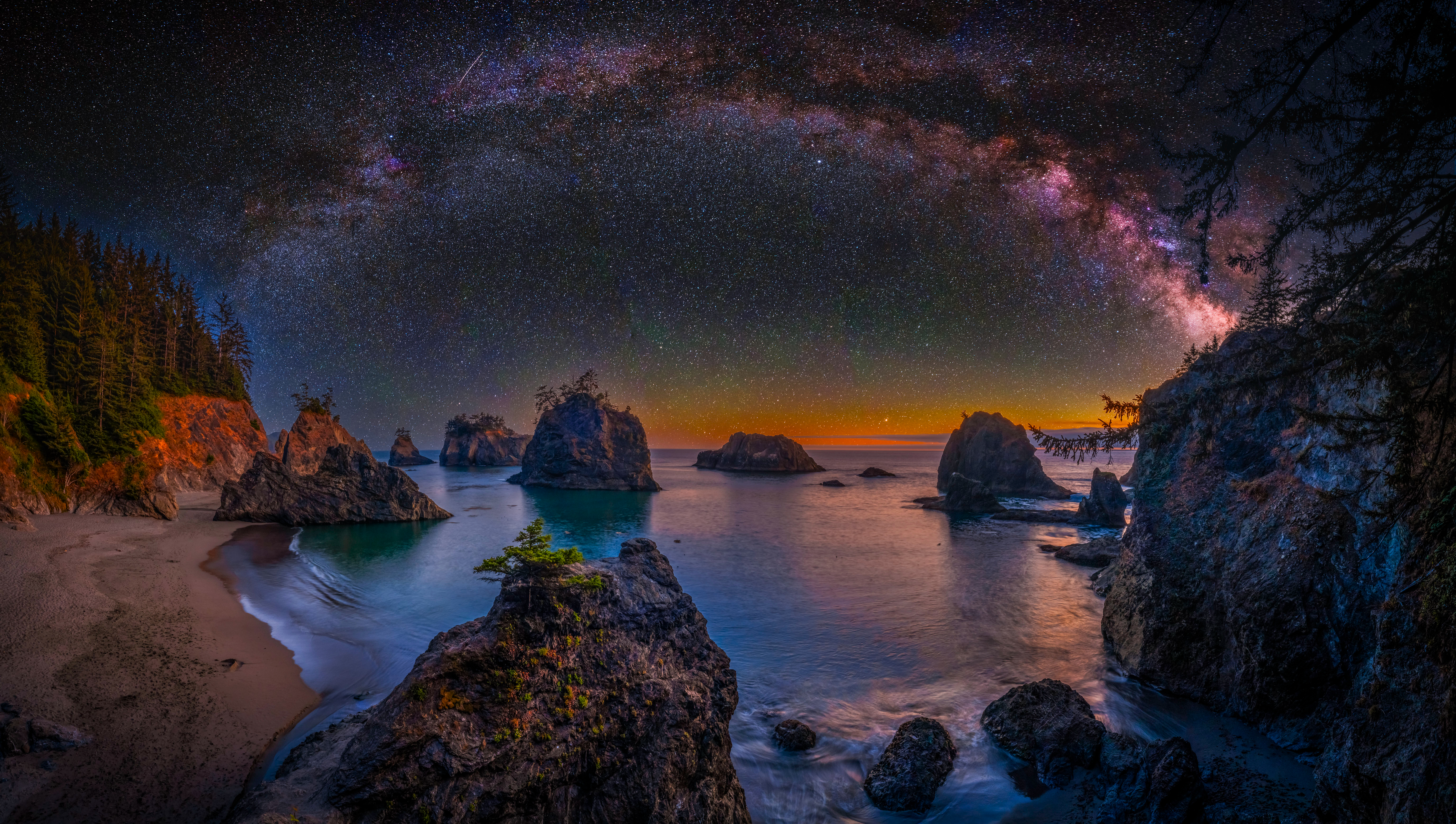 Milky Way over rocky coast at night HD Wallpaper