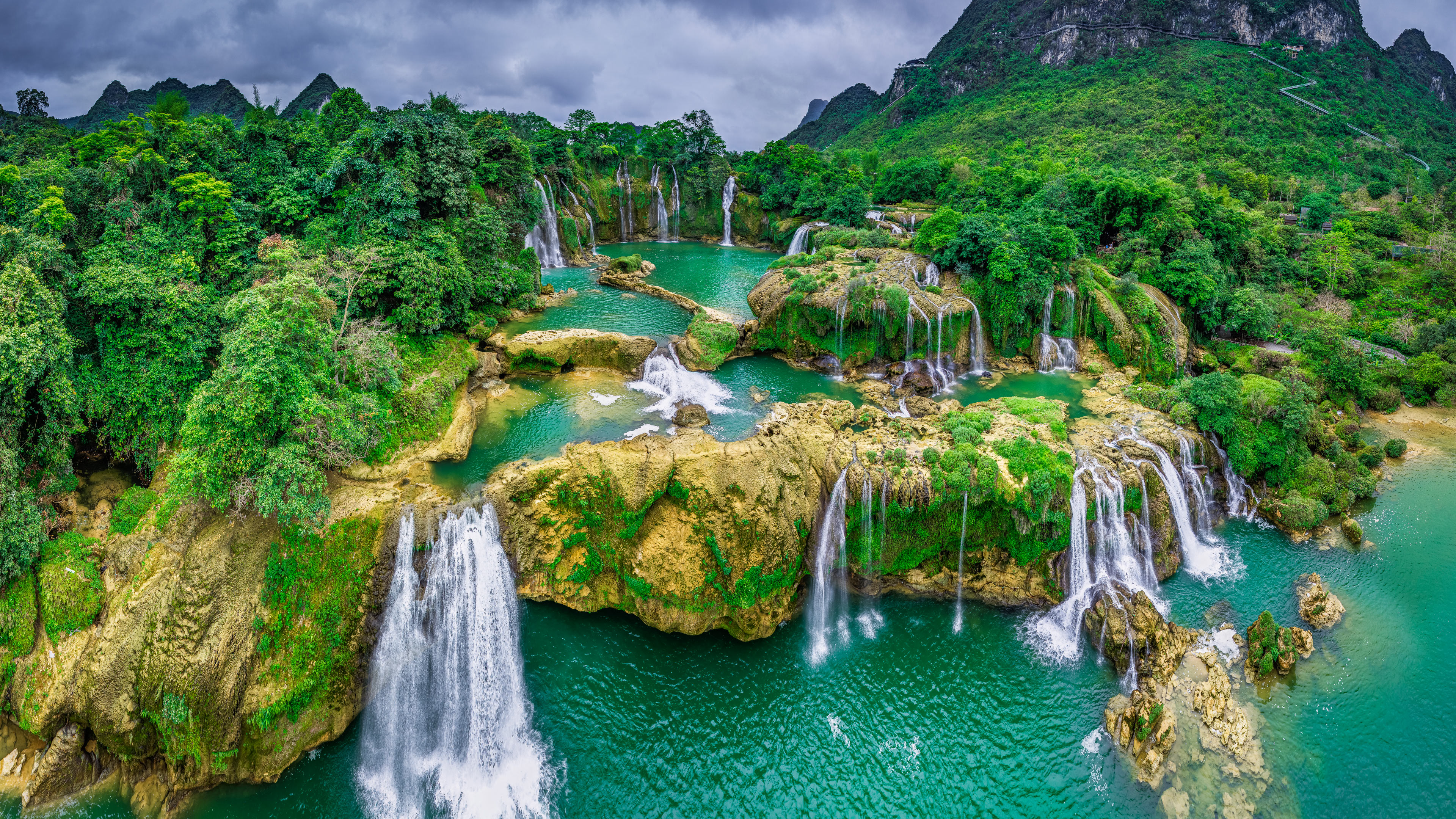 Ban Gioc Waterfall, Vietnam, with green mountains and water HD Wallpaper