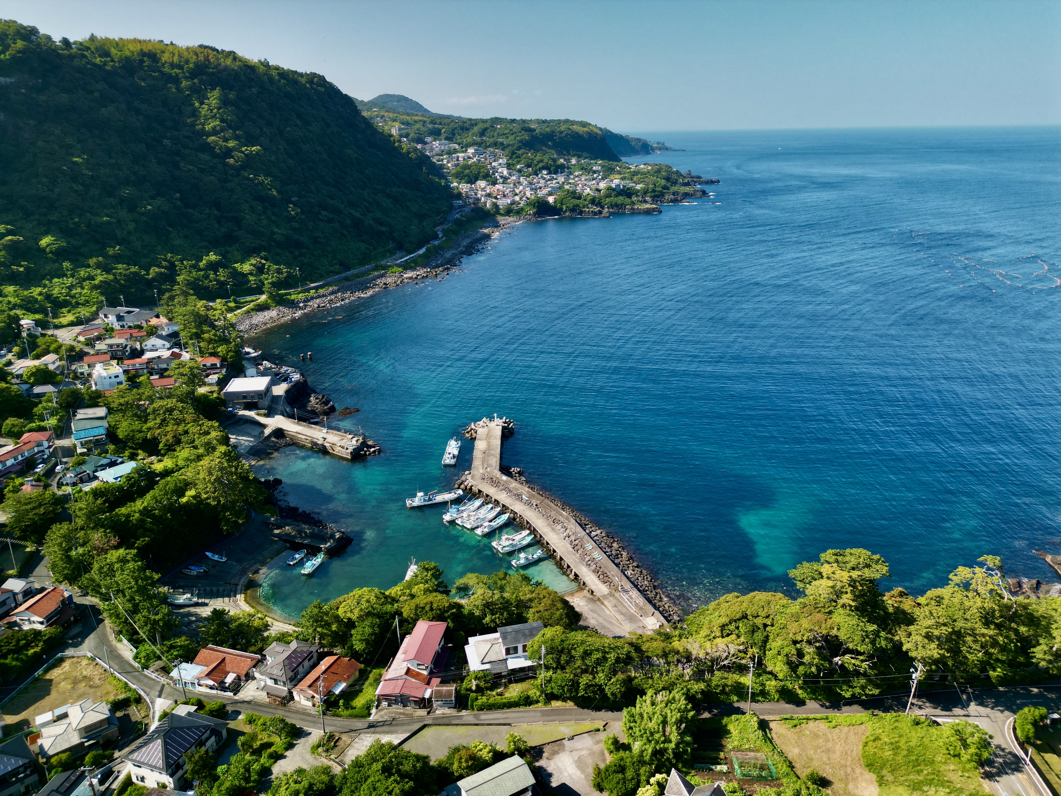 Coastal Japanese Village with Jetty and Boats HD Wallpaper