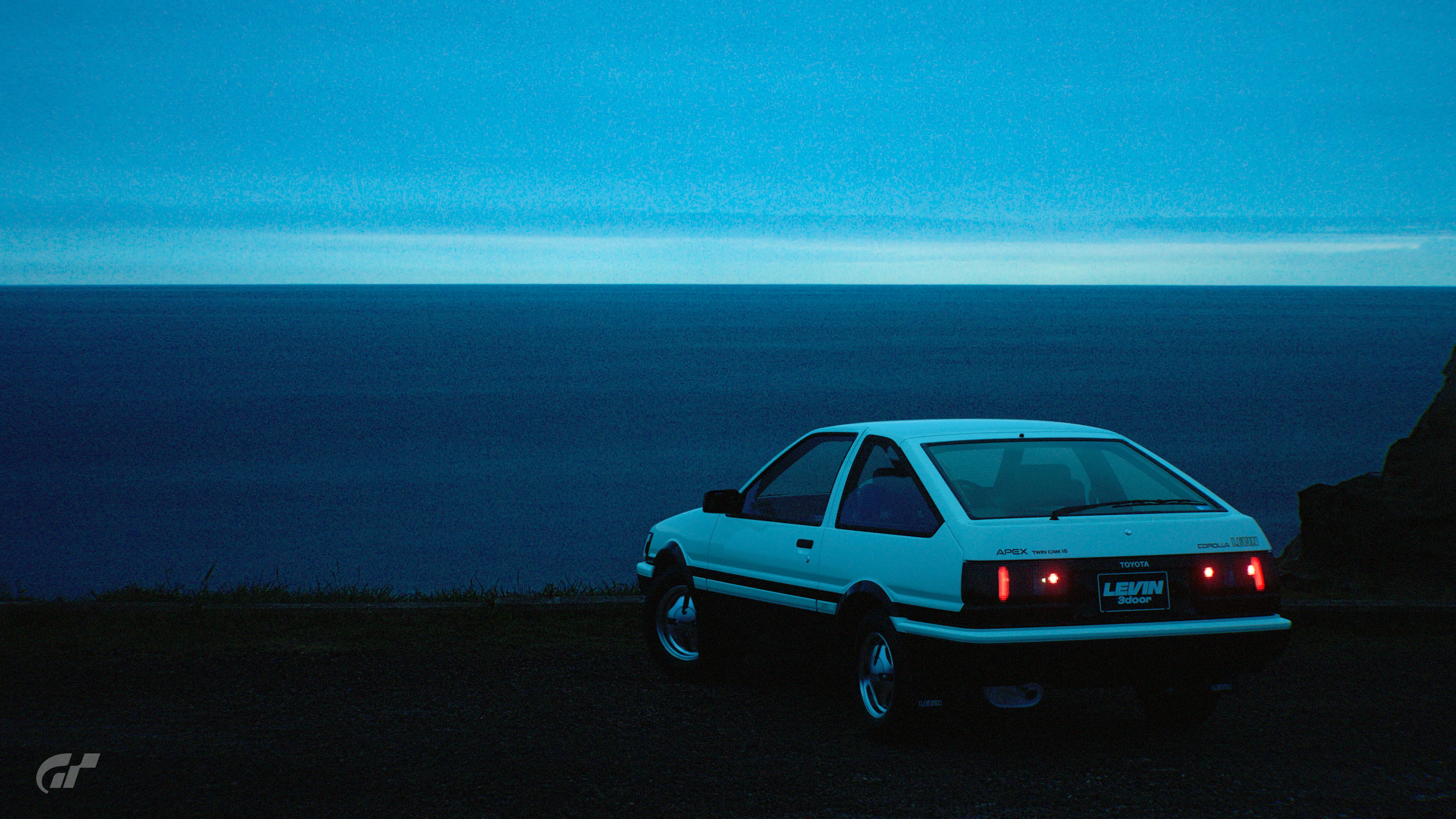 Toyota Corolla at dusk by the ocean HD Wallpaper