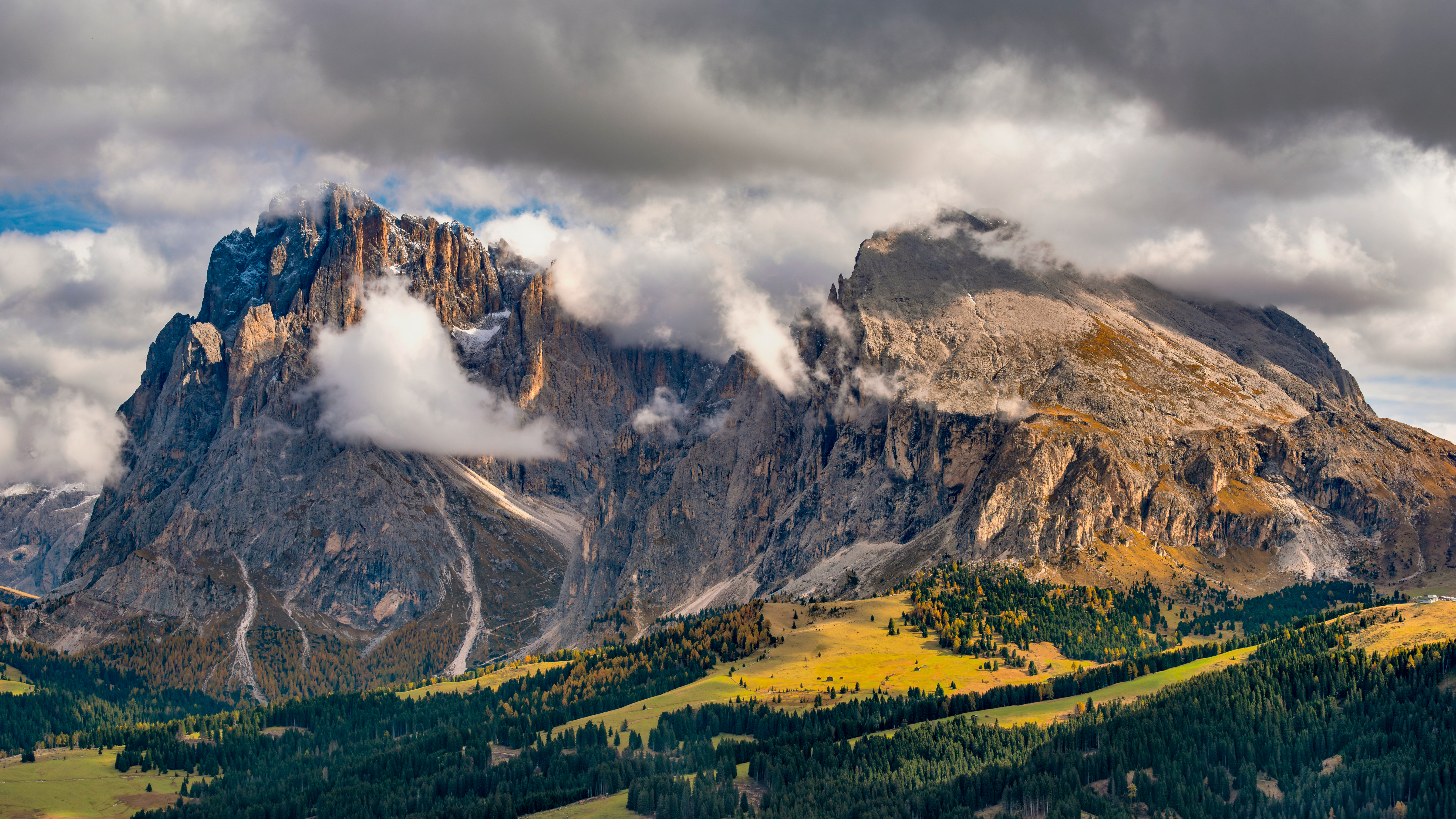 Rocky mountains with clouds and autumn trees HD Wallpaper