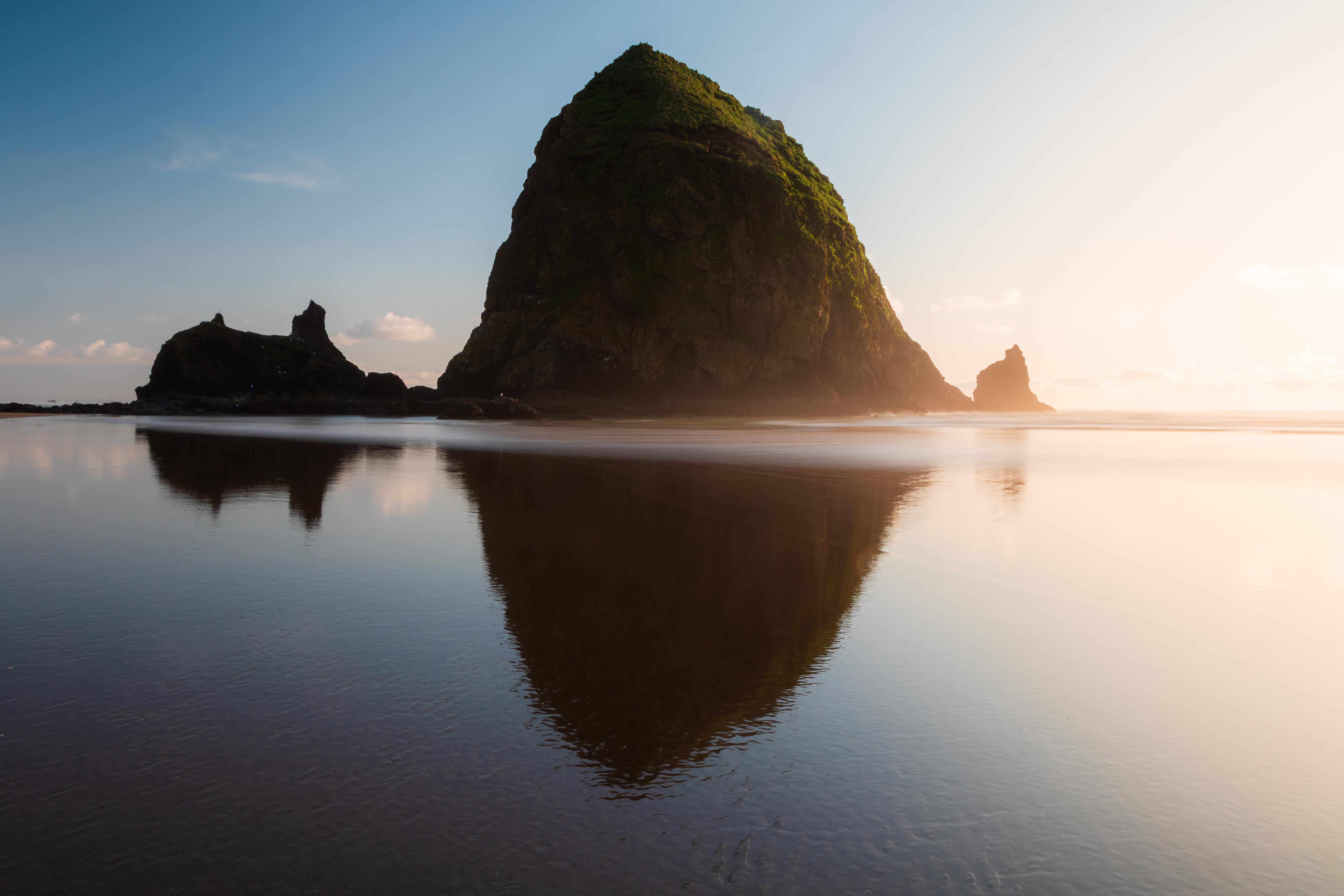 Haystack Rock reflection on Cannon Beach, Oregon HD Wallpaper