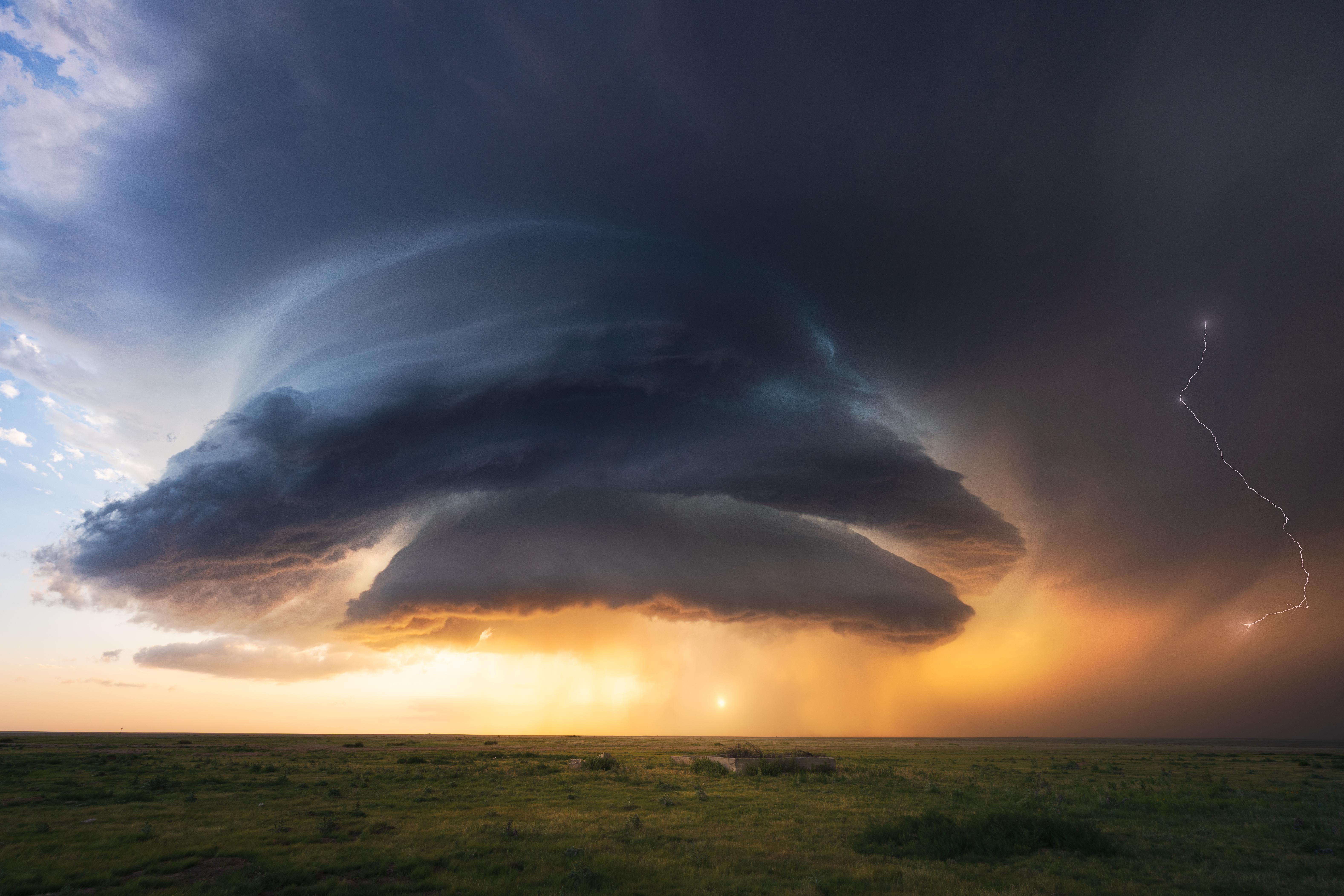 Supercell thunderstorm with lightning over New Mexico field HD Wallpaper