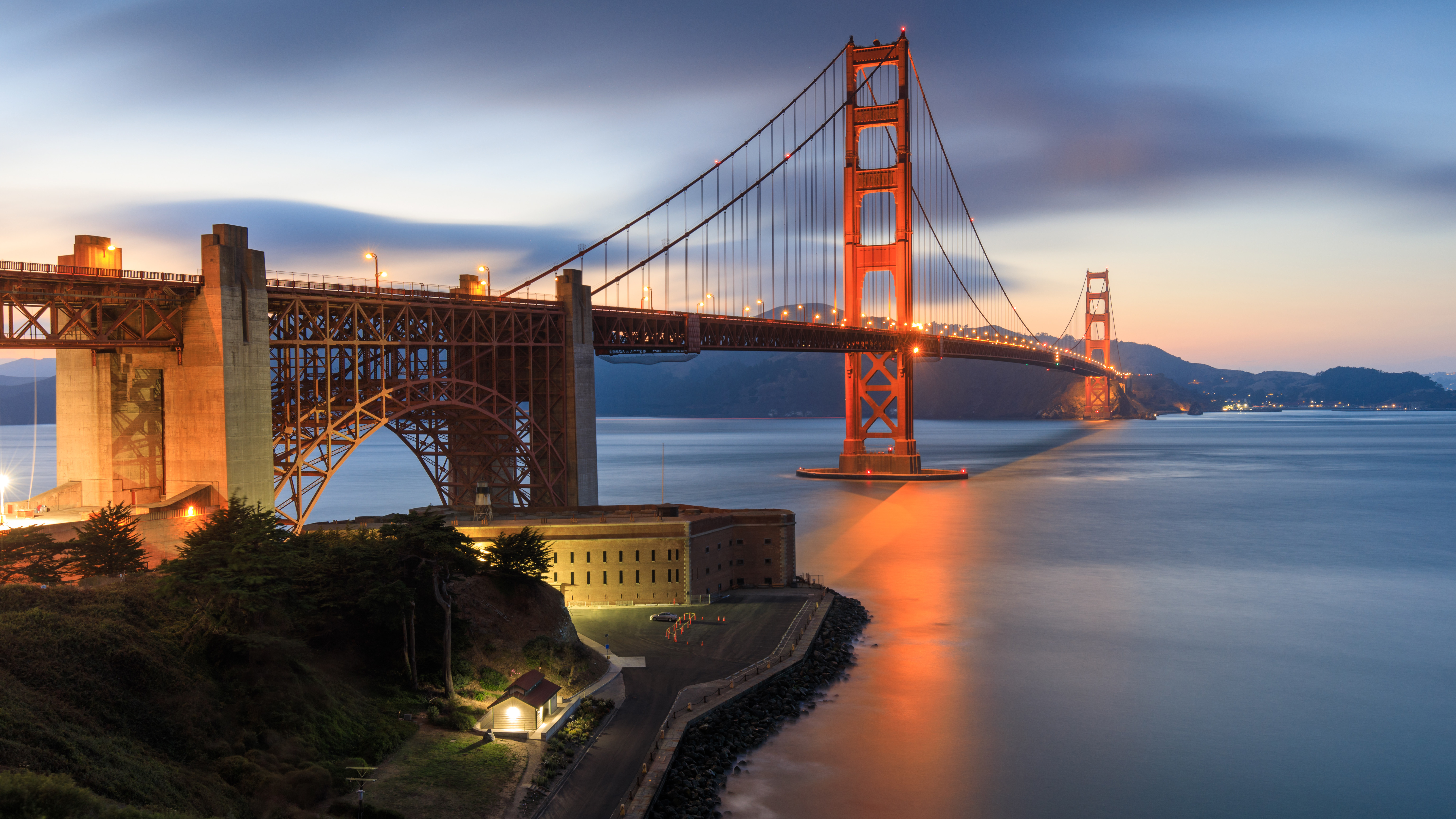 Golden Gate Bridge at dusk with calm water HD Wallpaper