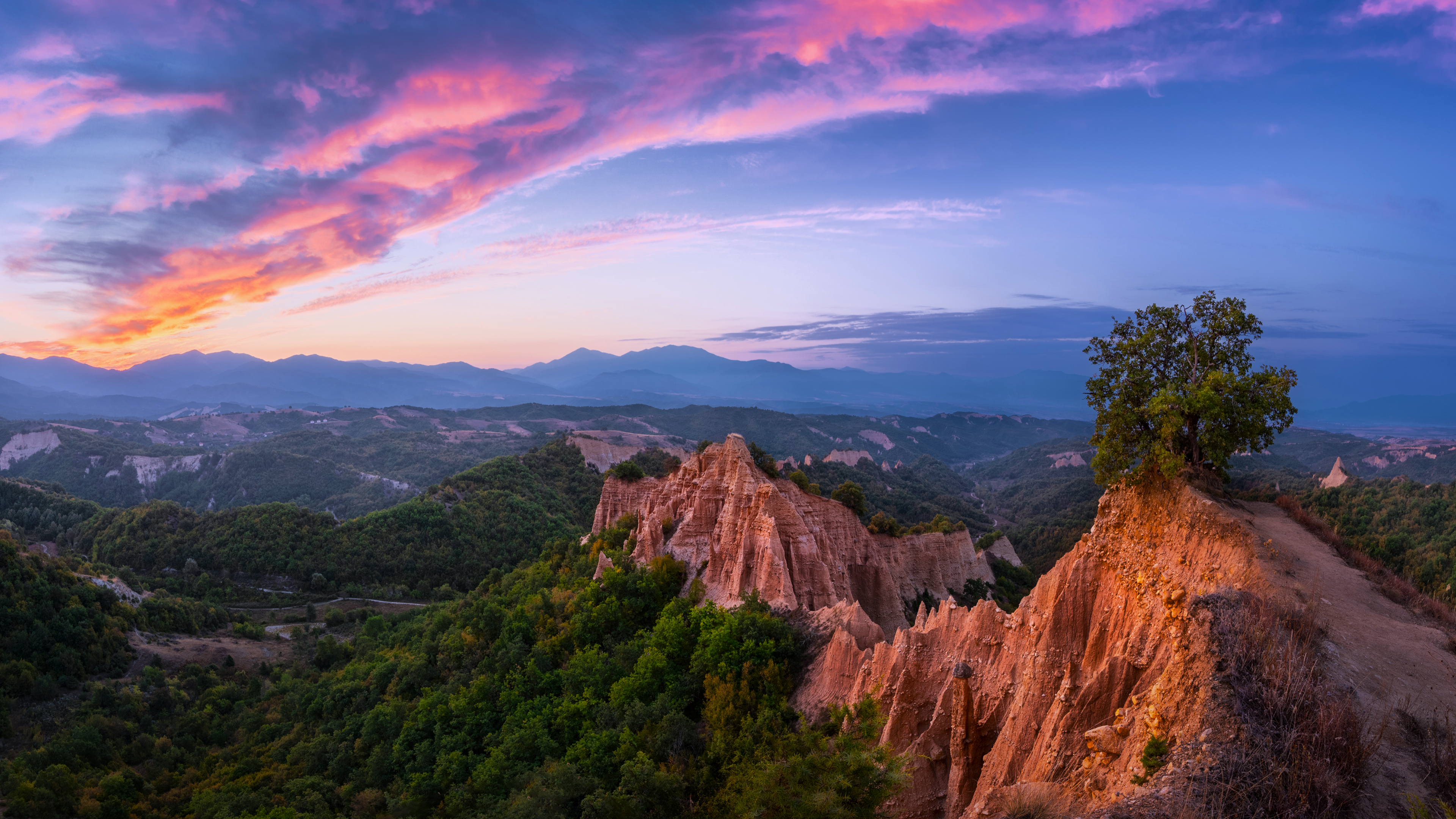 Melnik Earth Pyramids at sunset with colorful clouds HD Wallpaper