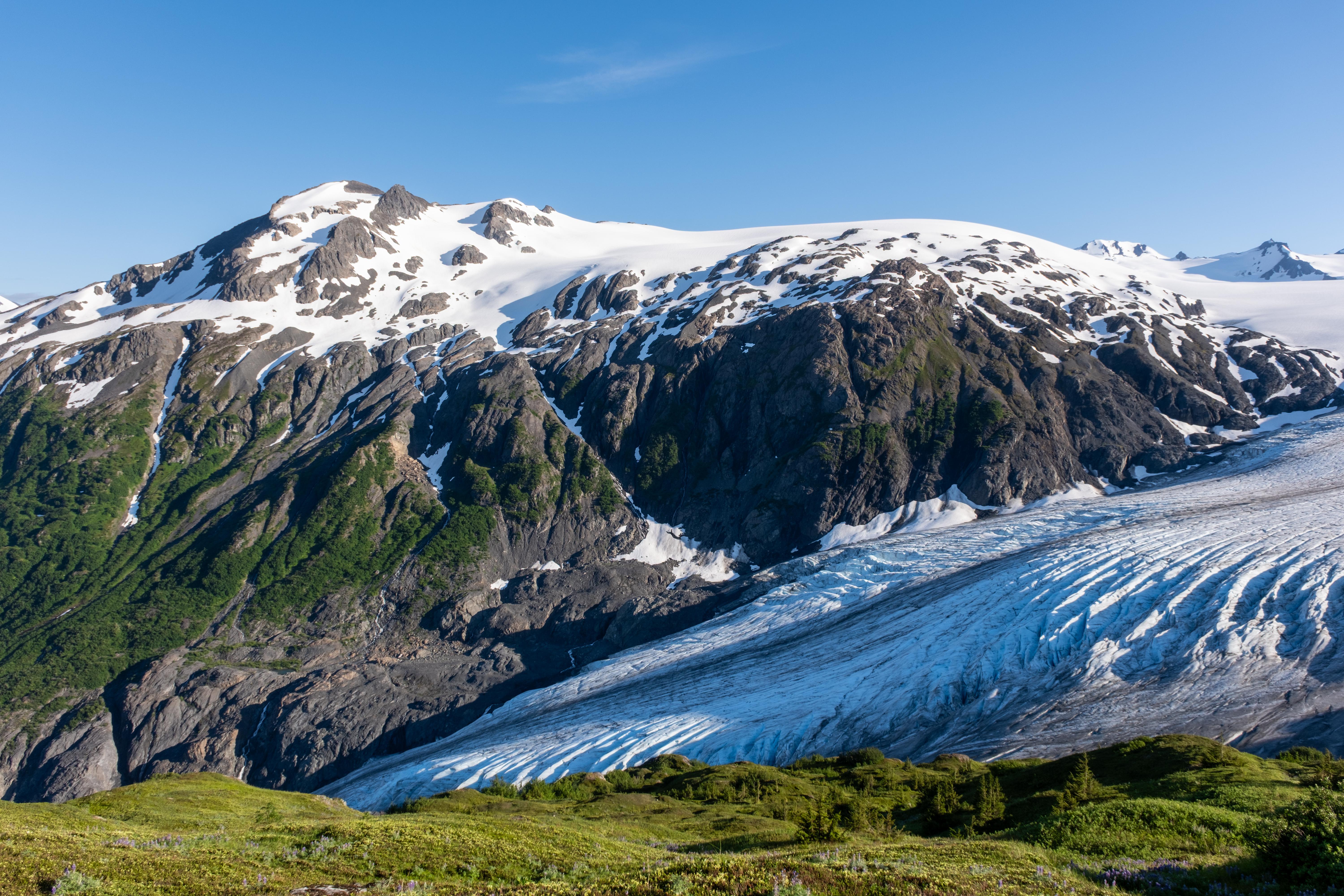 Snow-capped mountain with a glacier in Alaska, USA HD Wallpaper