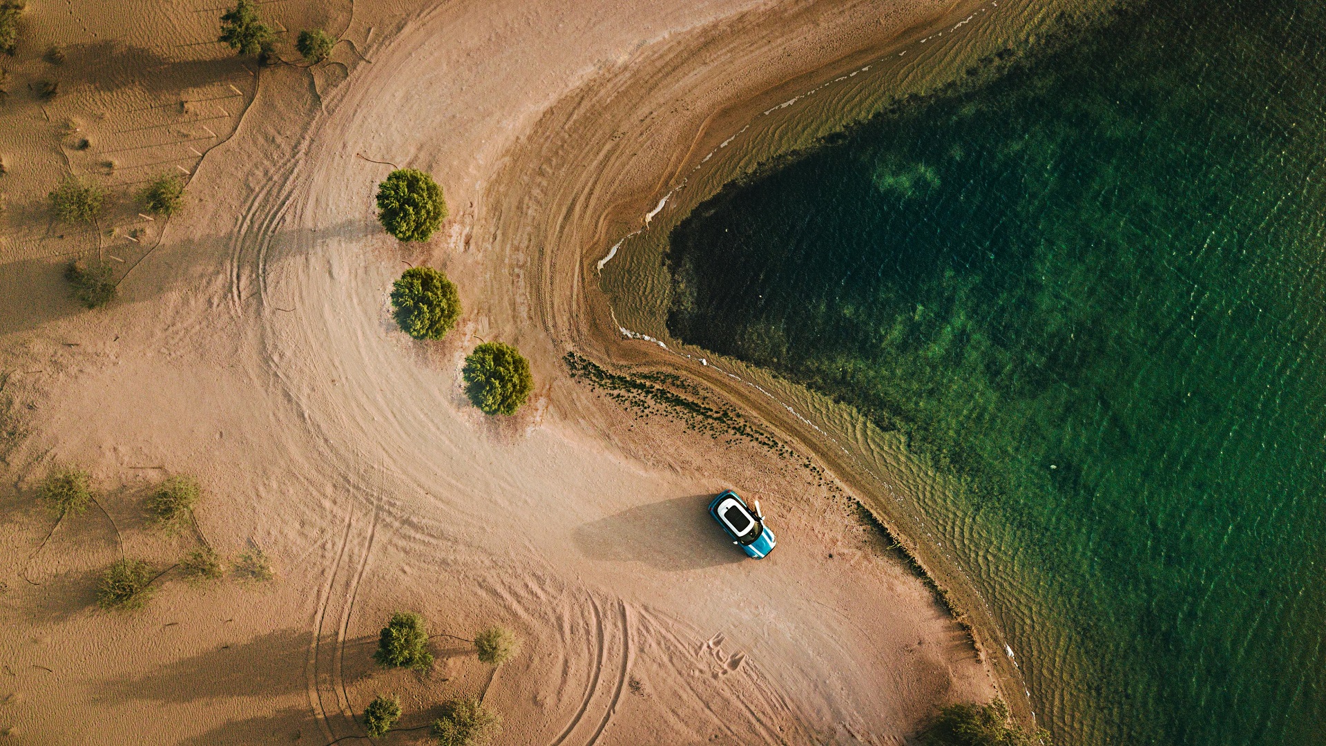 Blue Mini Cooper Countryman on a sandy beach by the water HD Wallpaper