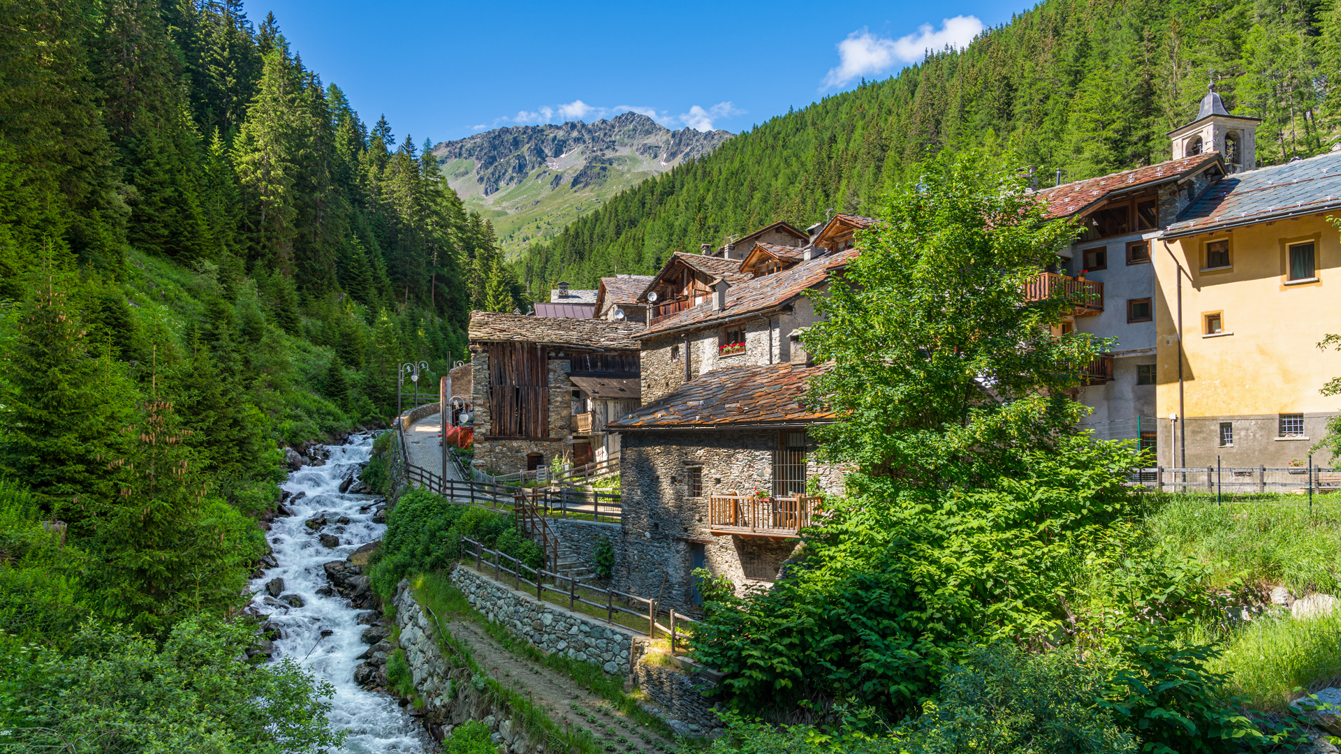 Mountain village with a river and forest HD Wallpaper