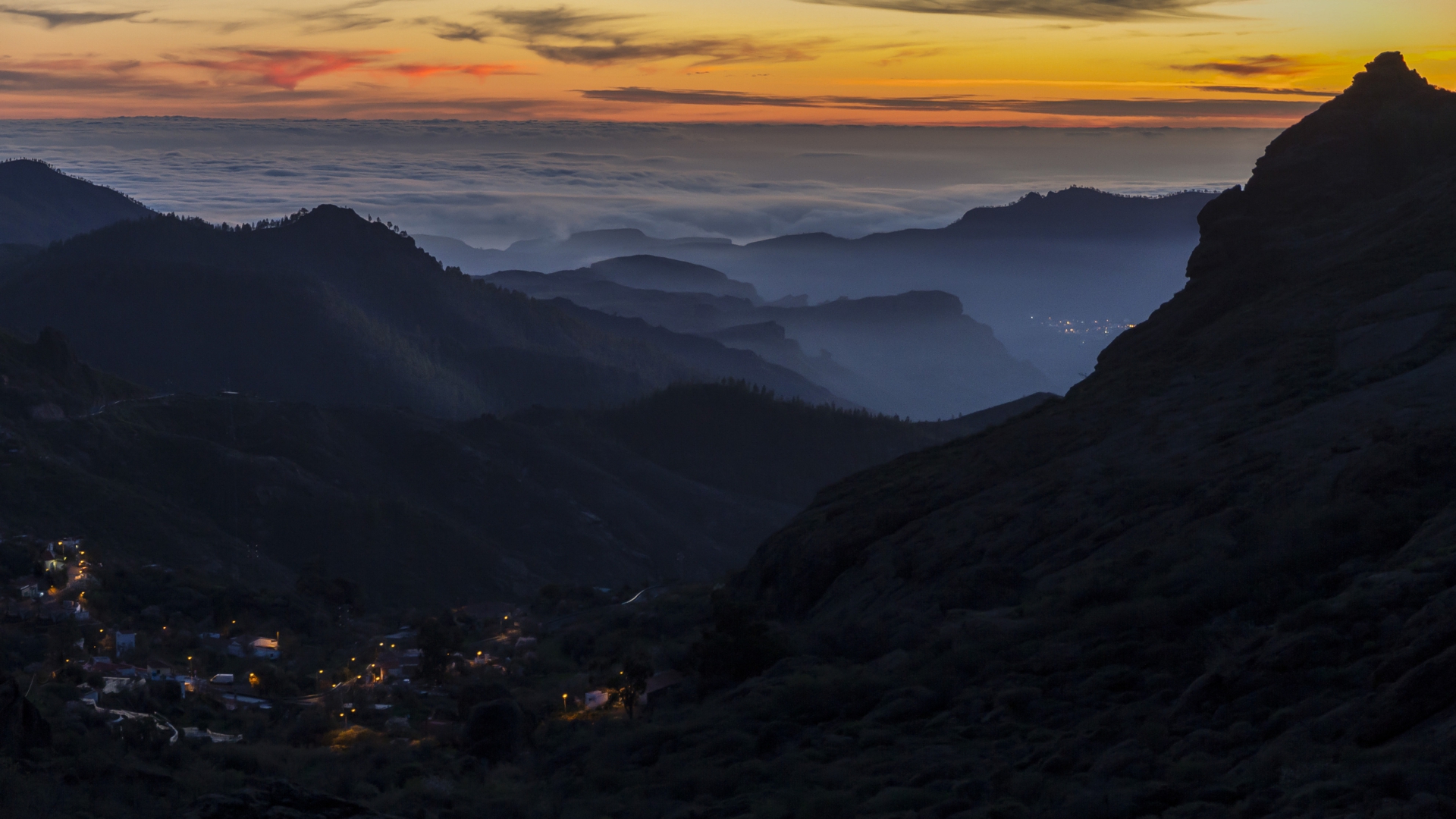 Mountain landscape with clouds and village at dusk HD Wallpaper