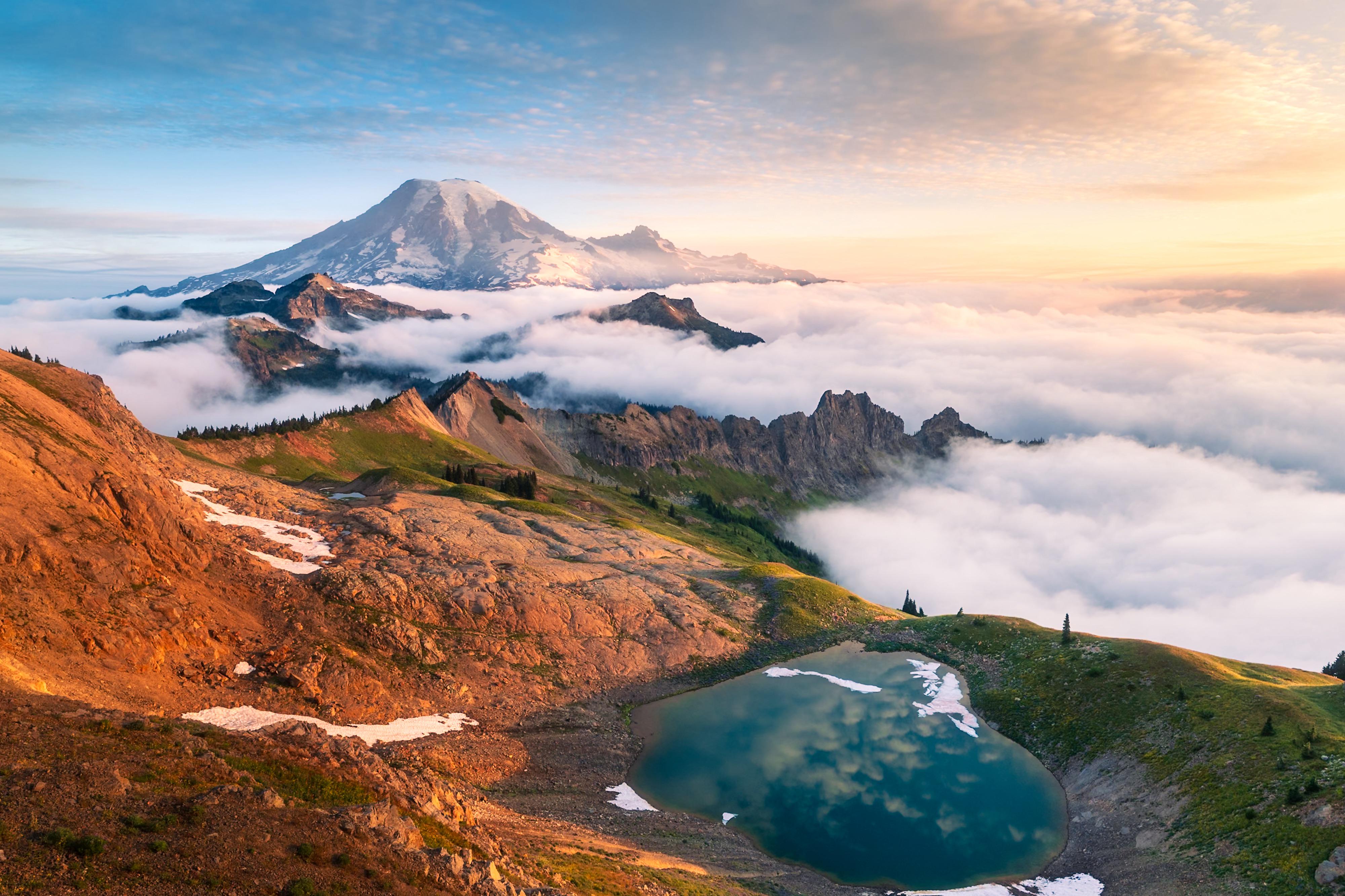 Mount Rainier above clouds with alpine lake reflection HD Wallpaper