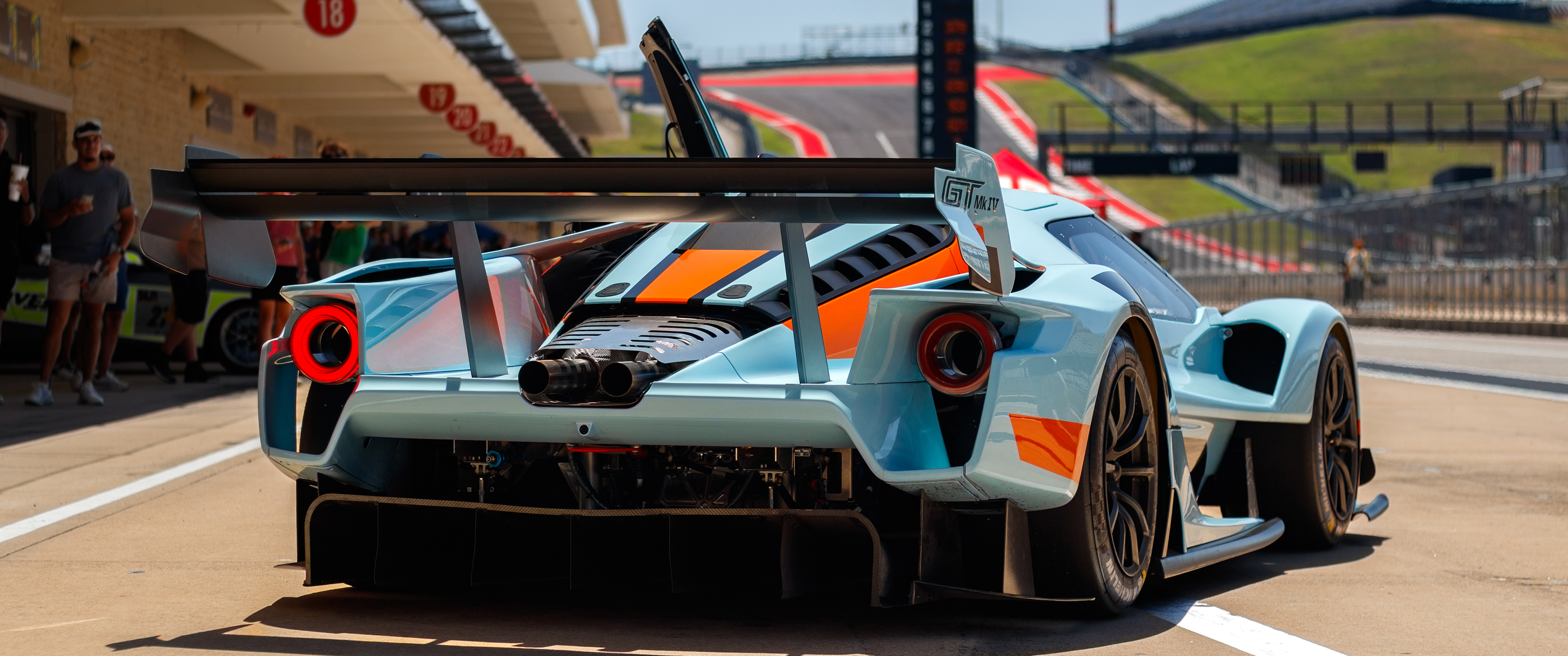 Ford GT MKIV race car at a race track HD Wallpaper