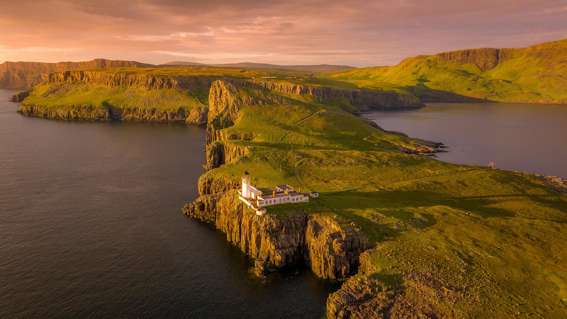 Neist Point Lighthouse on a cliff in Scotland HD Wallpaper