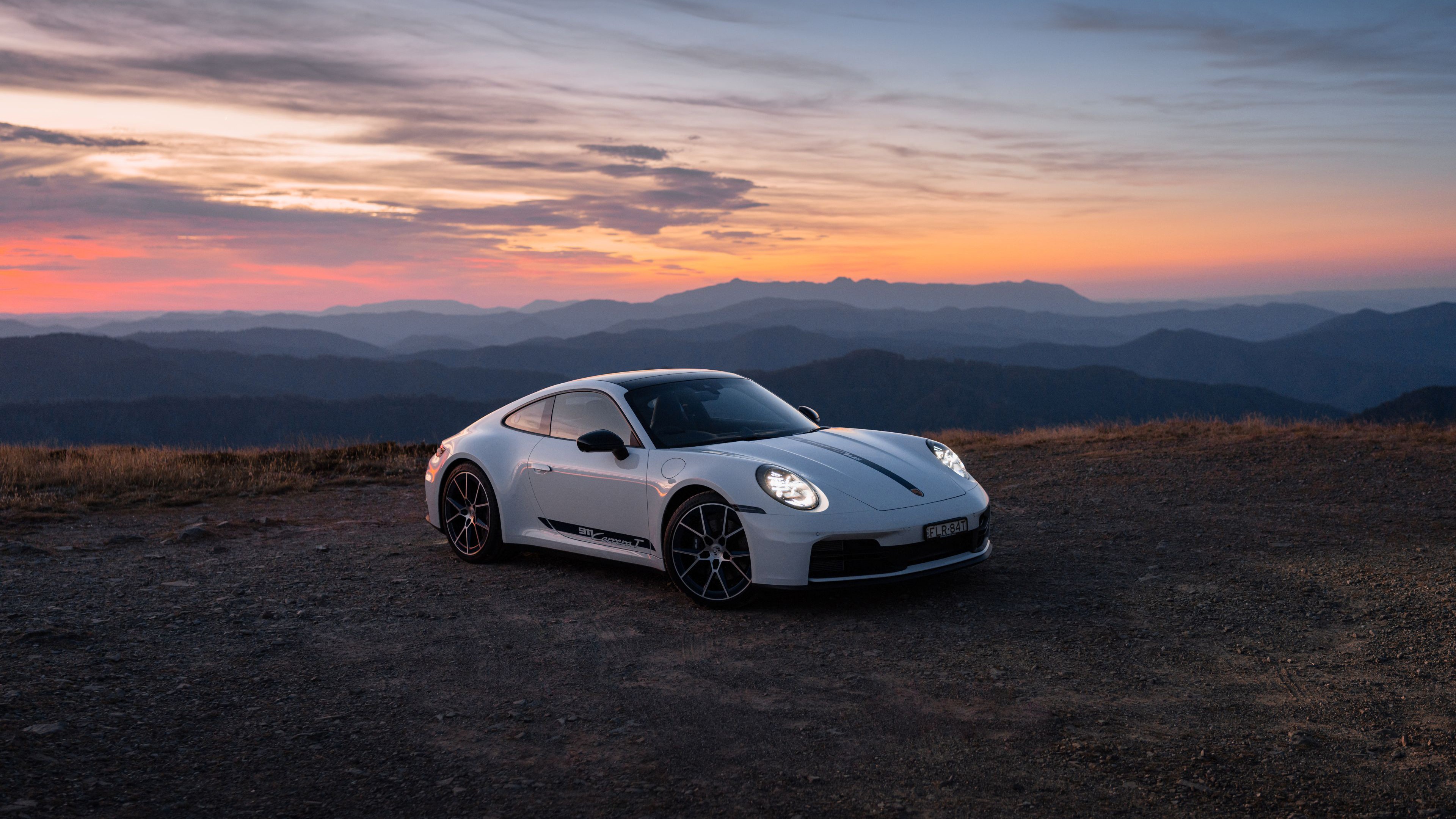 Porsche 991 supercar on a mountain road at sunset HD Wallpaper
