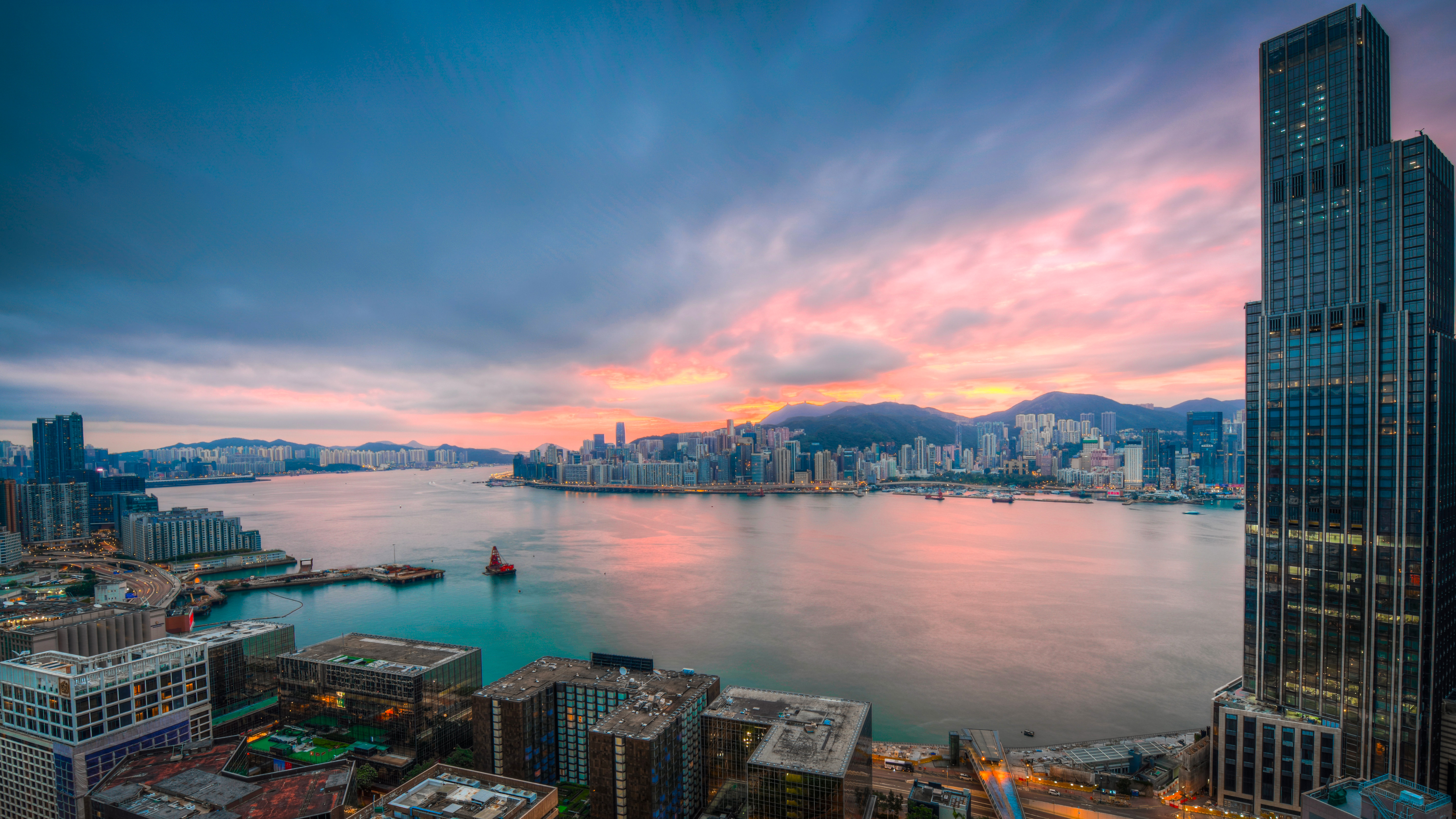 Boat in Victoria Harbour at Sunset HD Wallpaper