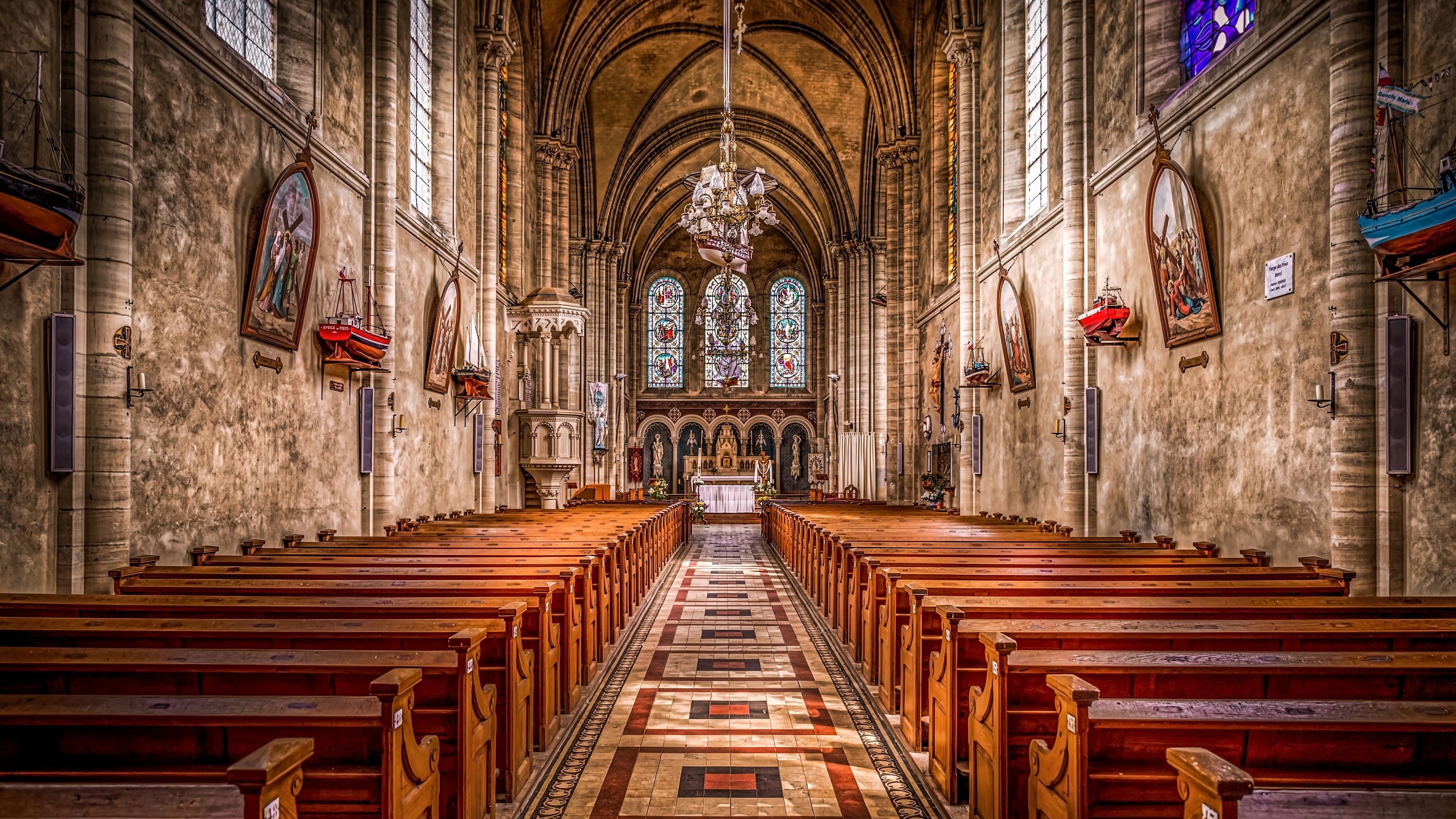 Interior of a Gothic Church with Wooden Pews HD Wallpaper