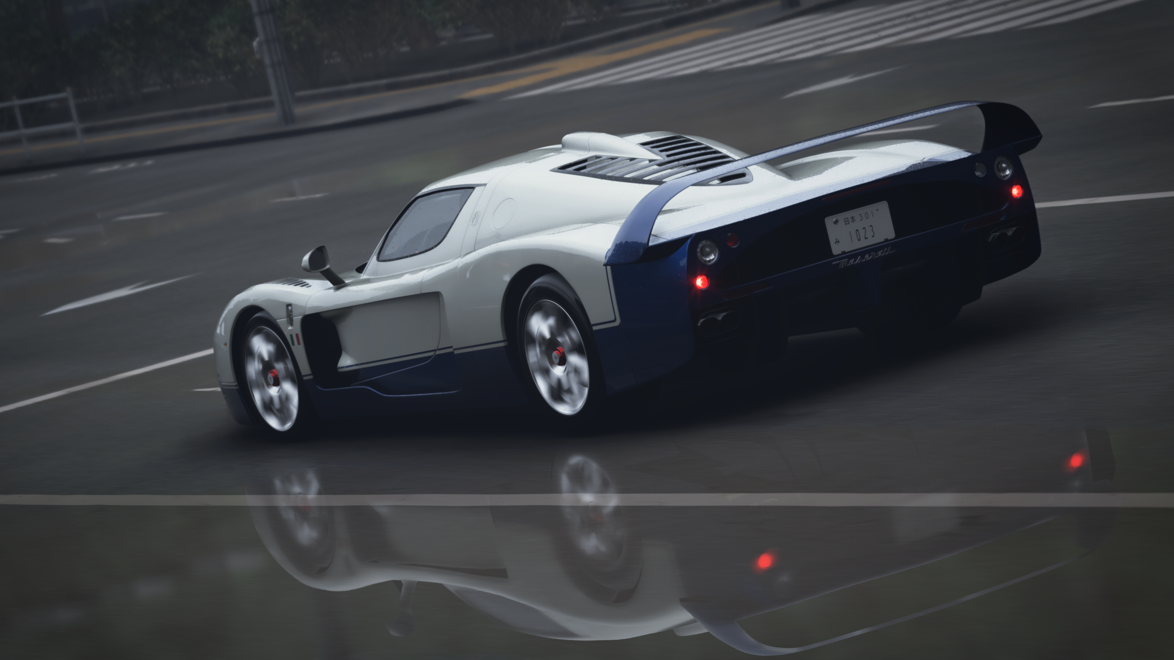 White and Blue Maserati MC12 on Wet Road HD Wallpaper