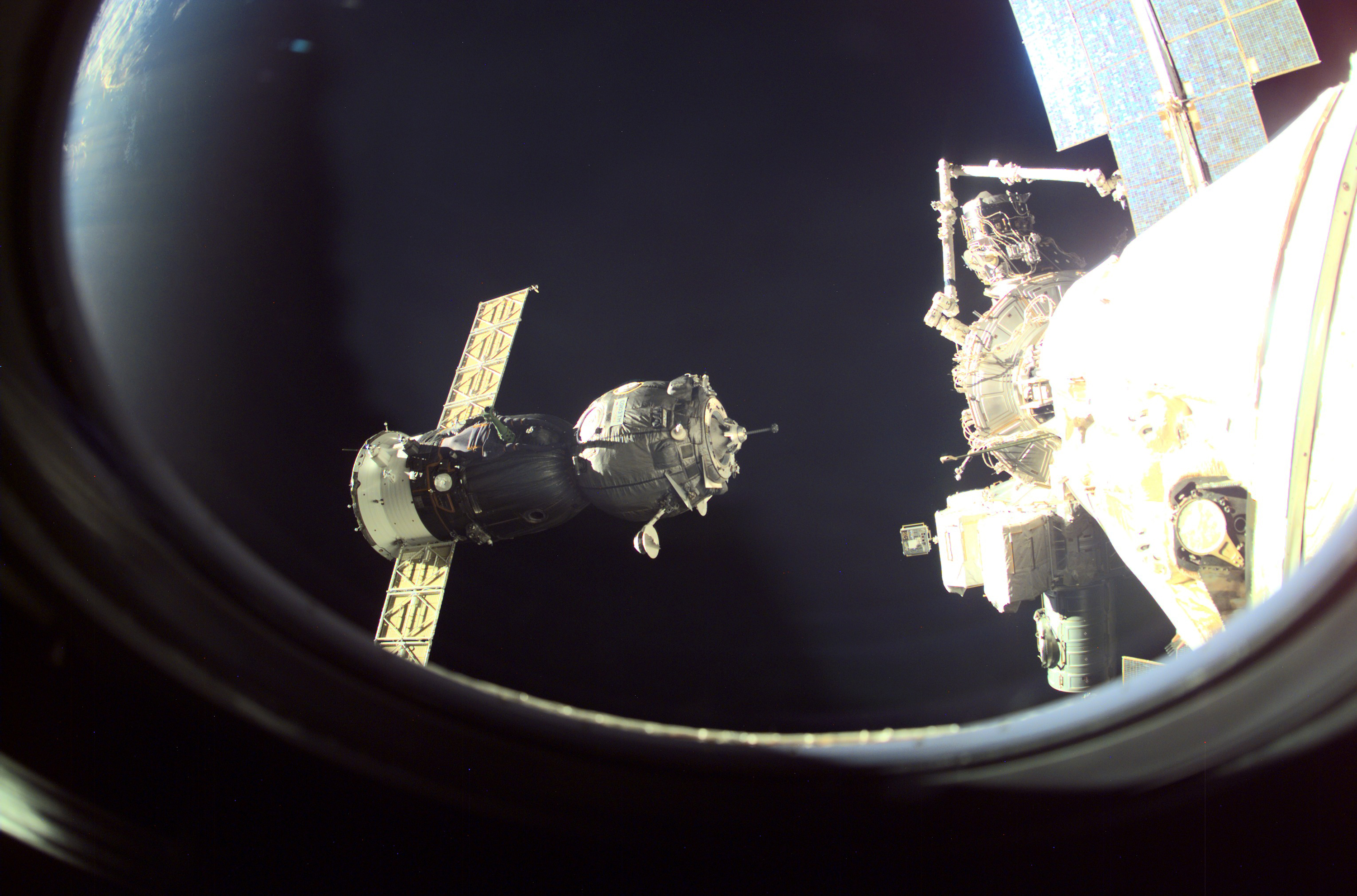 Soyuz Spacecraft Approaching the International Space Station HD Wallpaper