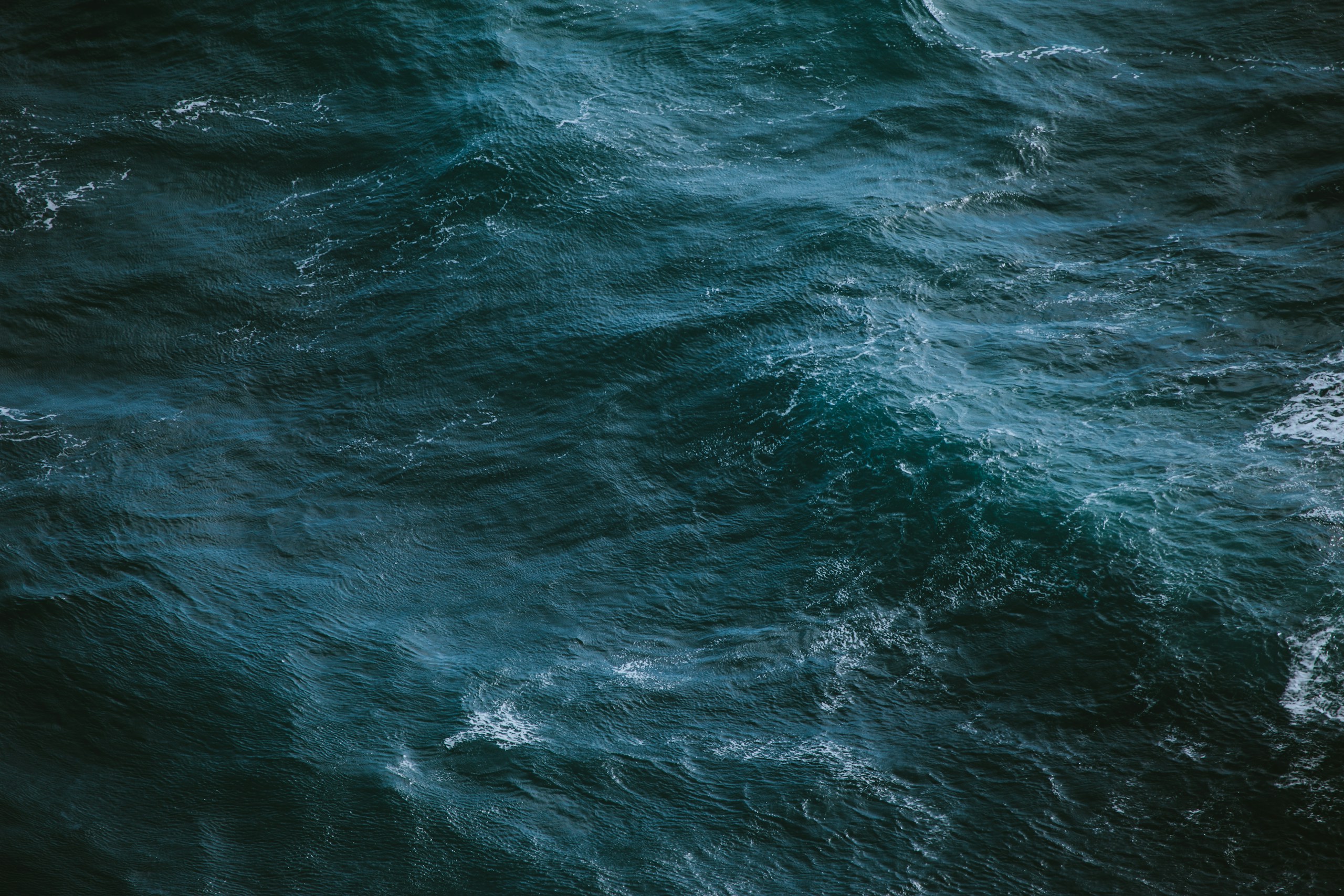 Aerial view of deep blue ocean water HD Wallpaper