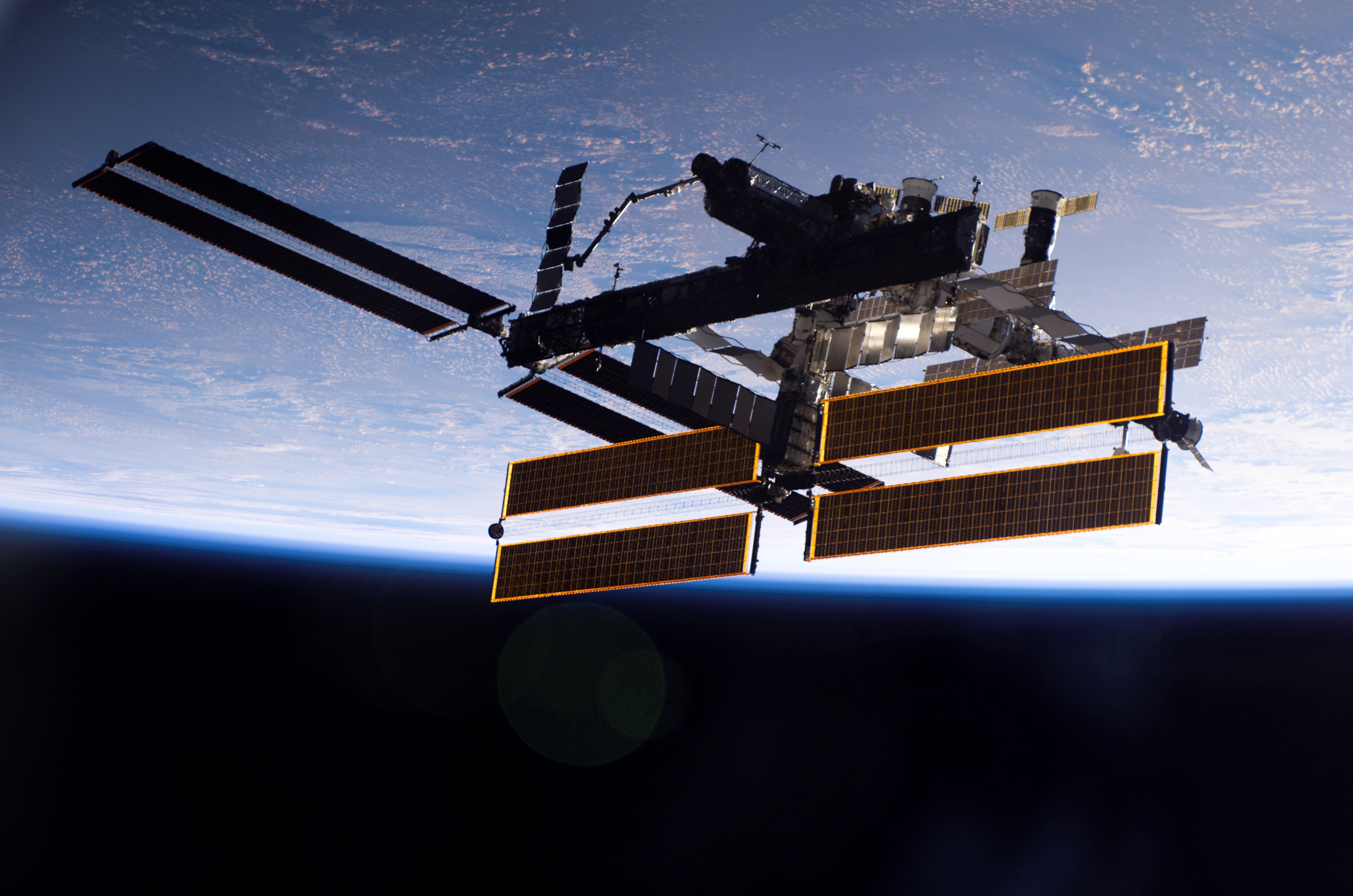 The International Space Station in Orbit Above Earth HD Wallpaper