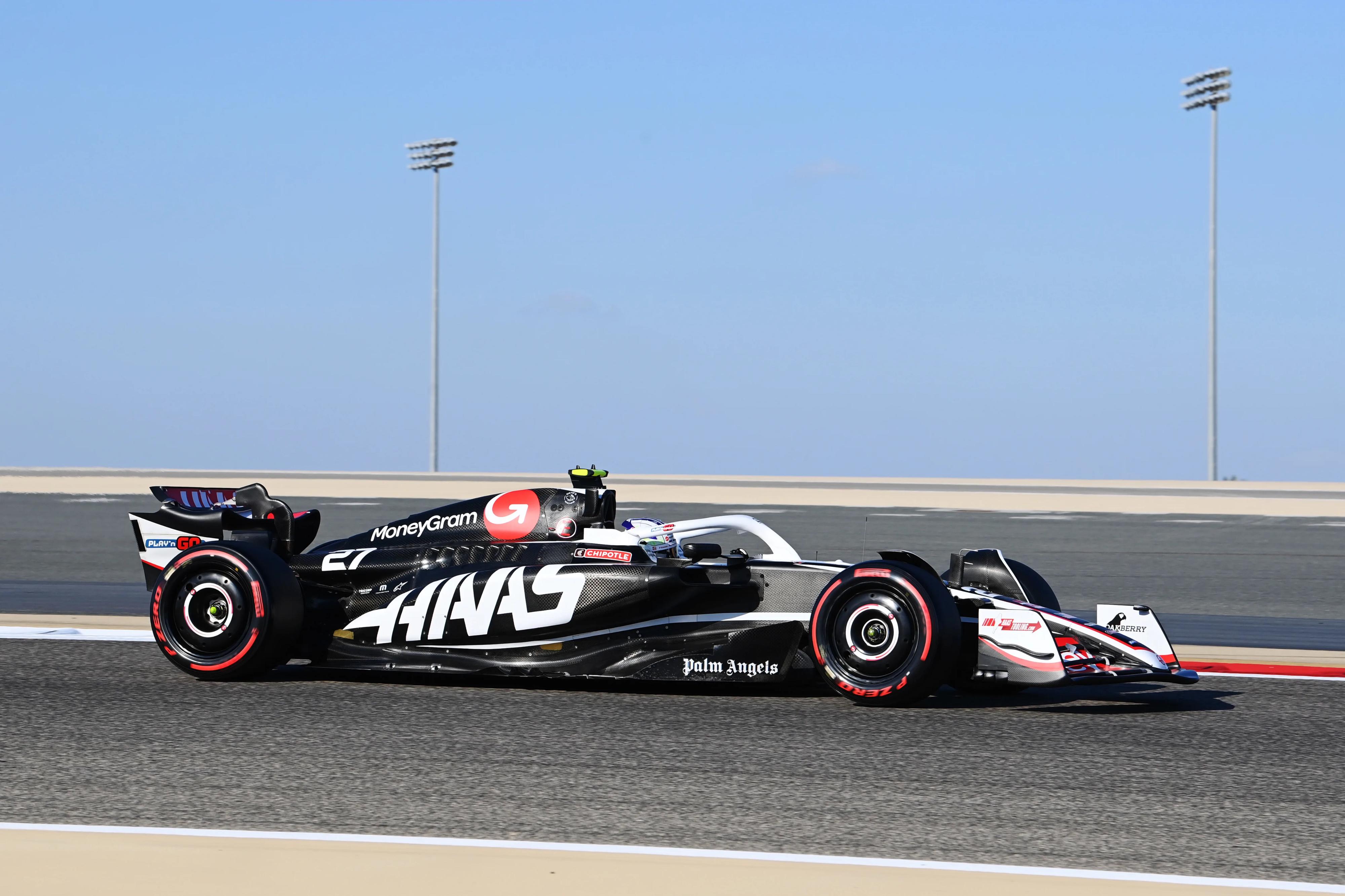 Haas F1 Team Racing Car on Track HD Wallpaper