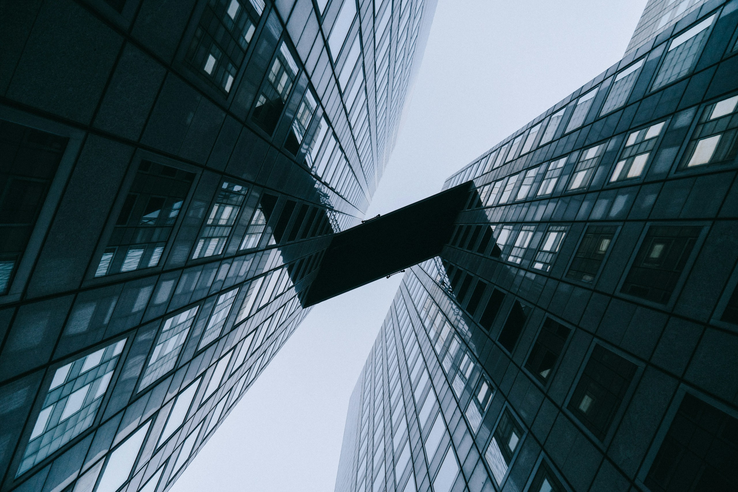 Low Angle View of Modern Skyscrapers with Skybridge HD Wallpaper