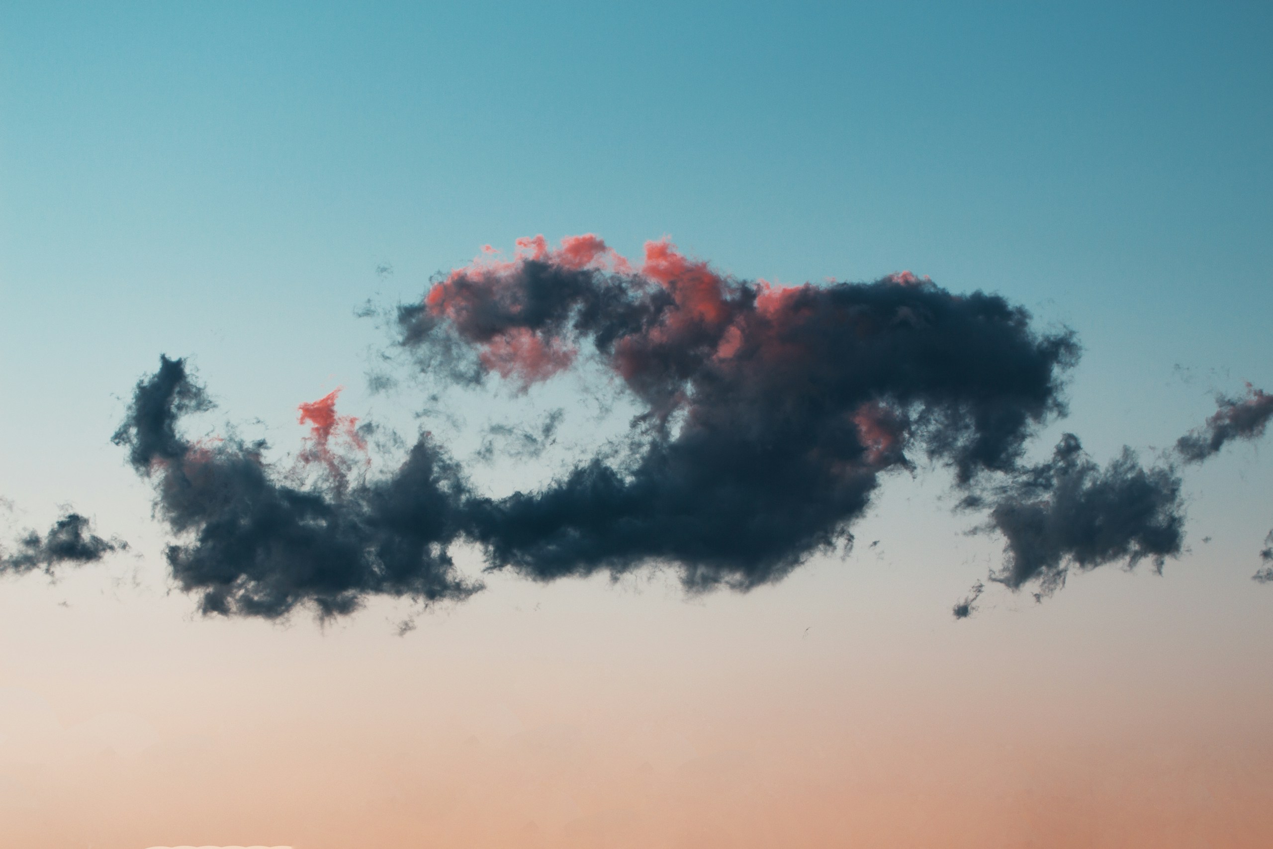 Dark cloud with pink highlights in a gradient sky HD Wallpaper
