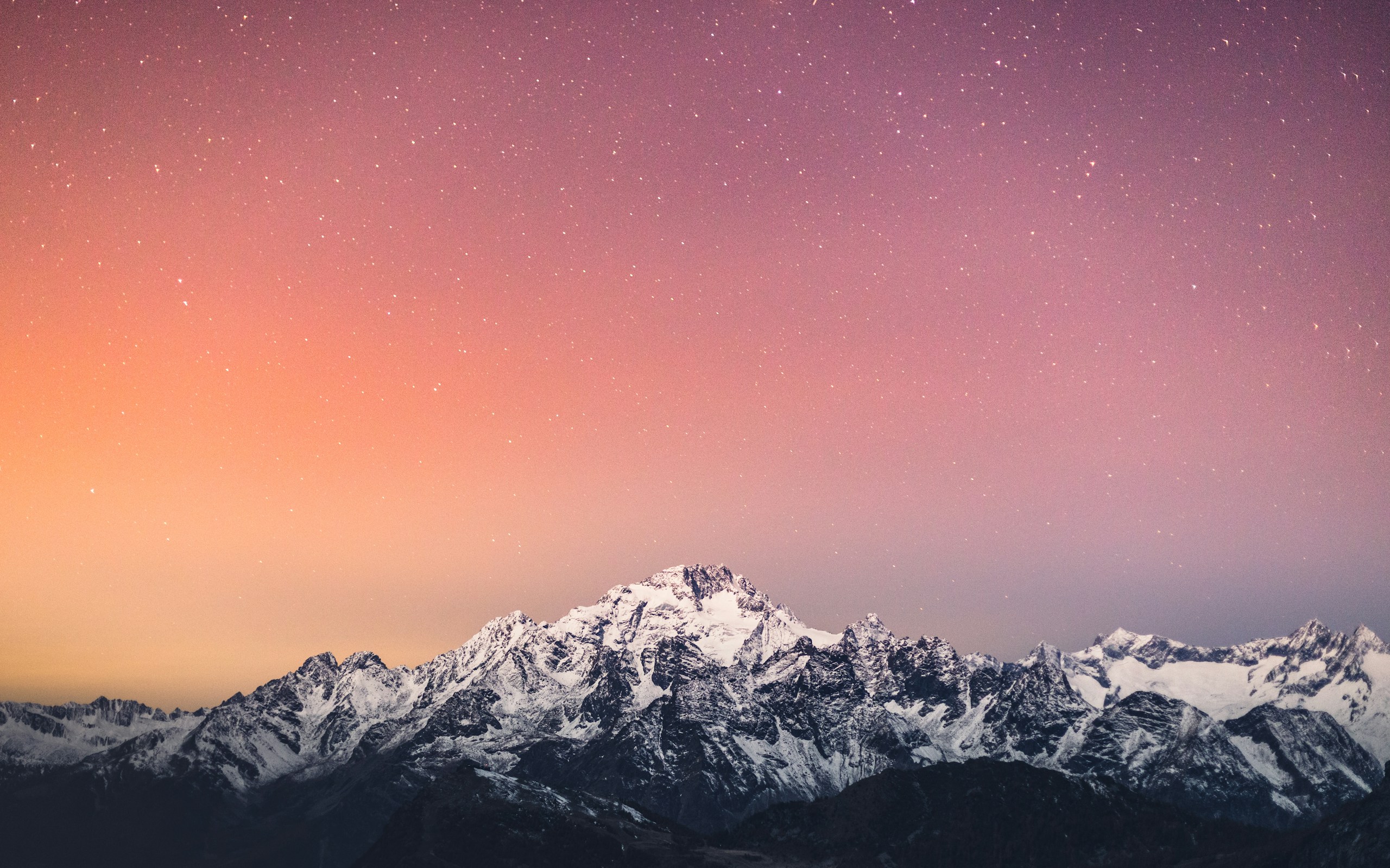 Snowy mountain range under starry gradient sky HD Wallpaper