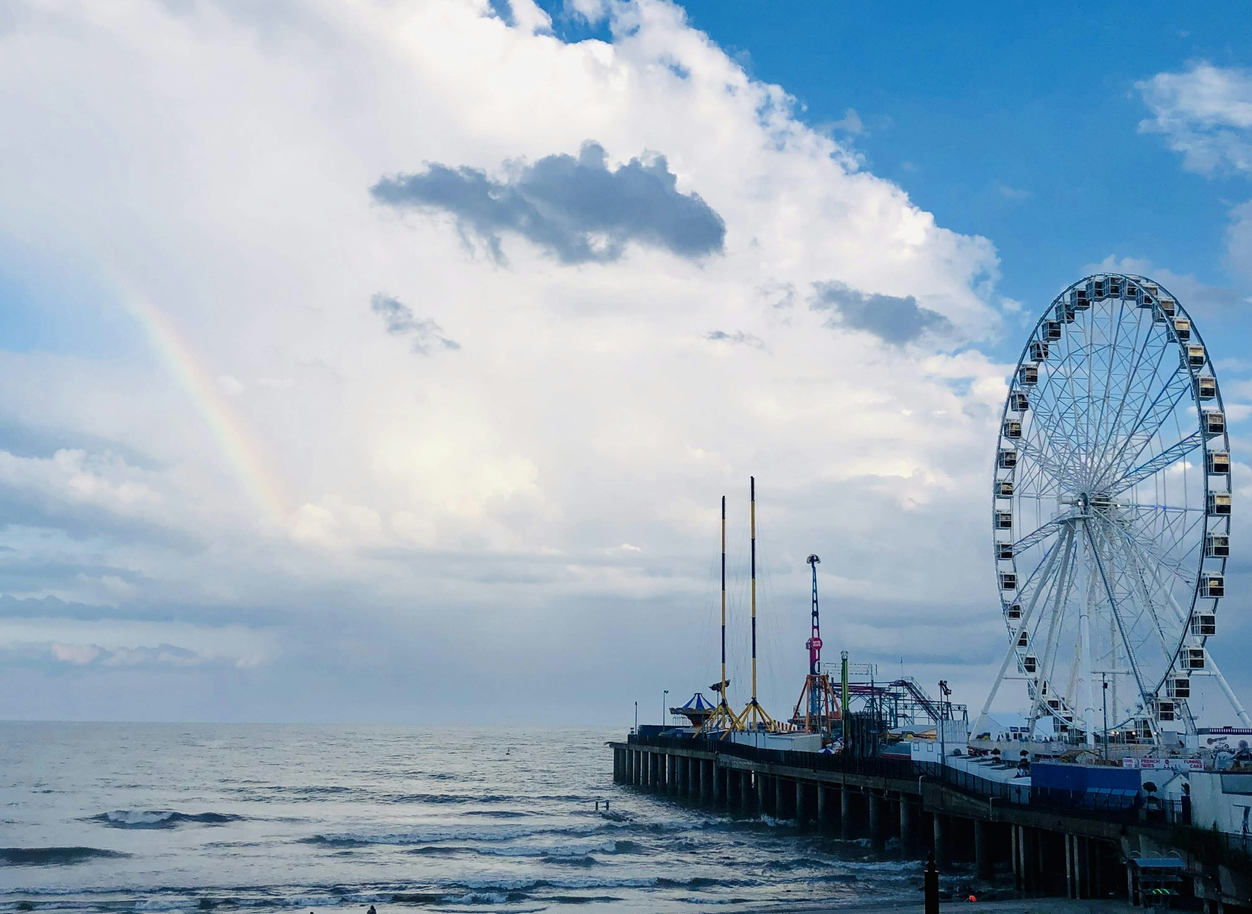 Amusement park pier with Ferris wheel under a rainbow HD Wallpaper