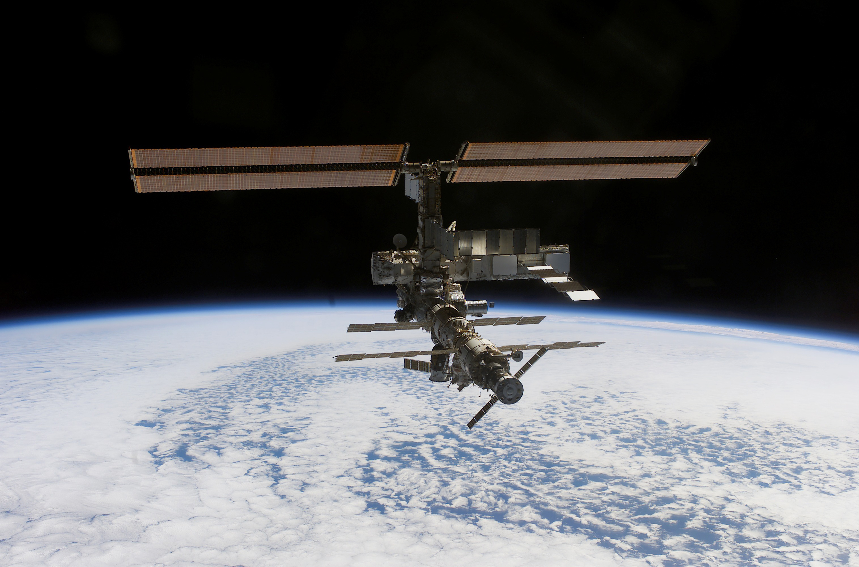 International Space Station Orbiting Above Earth HD Wallpaper