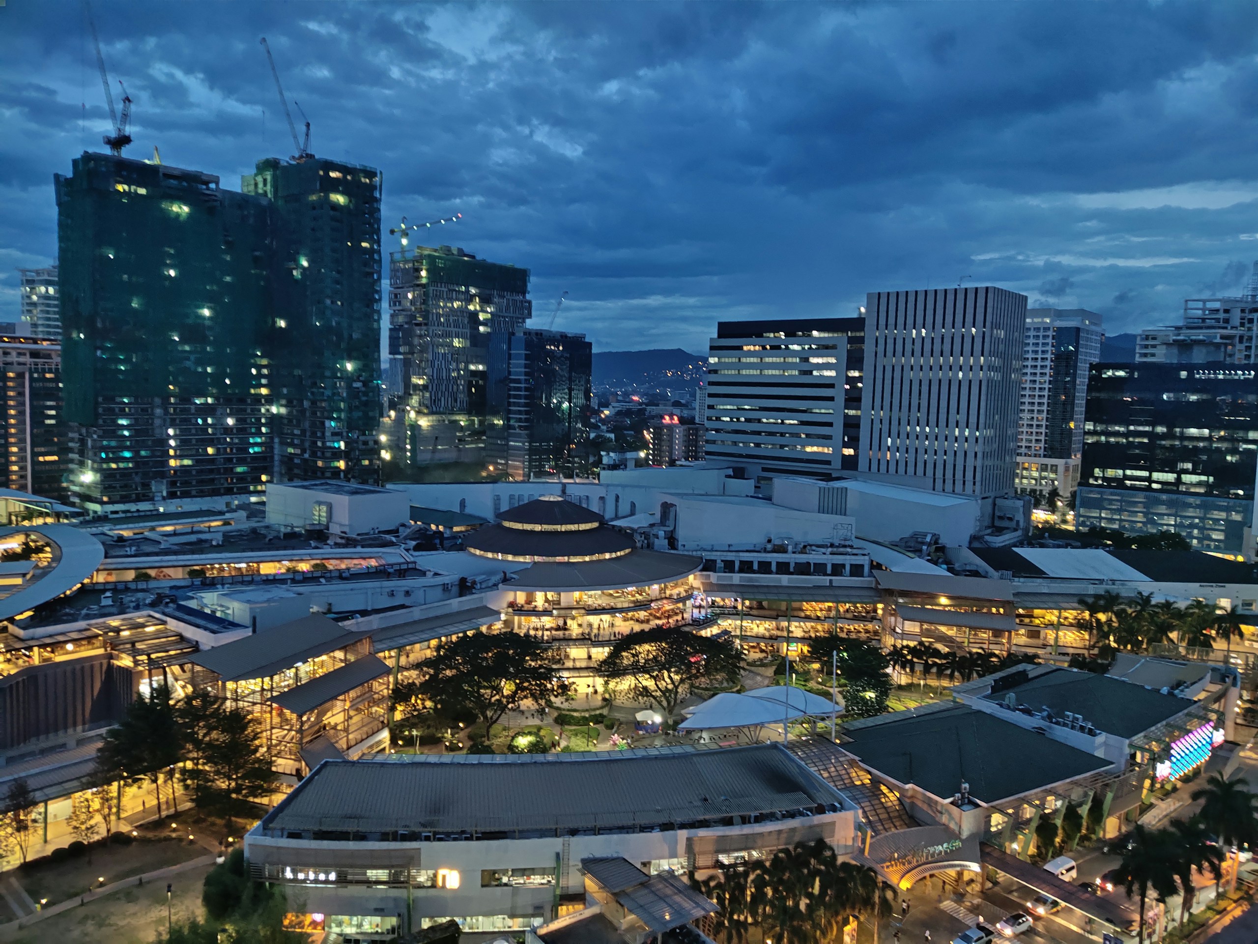 High-Angle View of a Modern City Plaza at Dusk HD Wallpaper