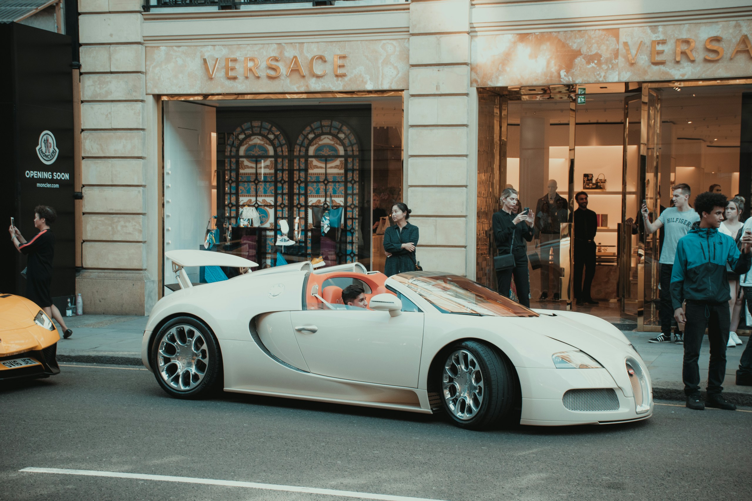 White Bugatti Veyron Roadster in Front of Versace Store HD Wallpaper
