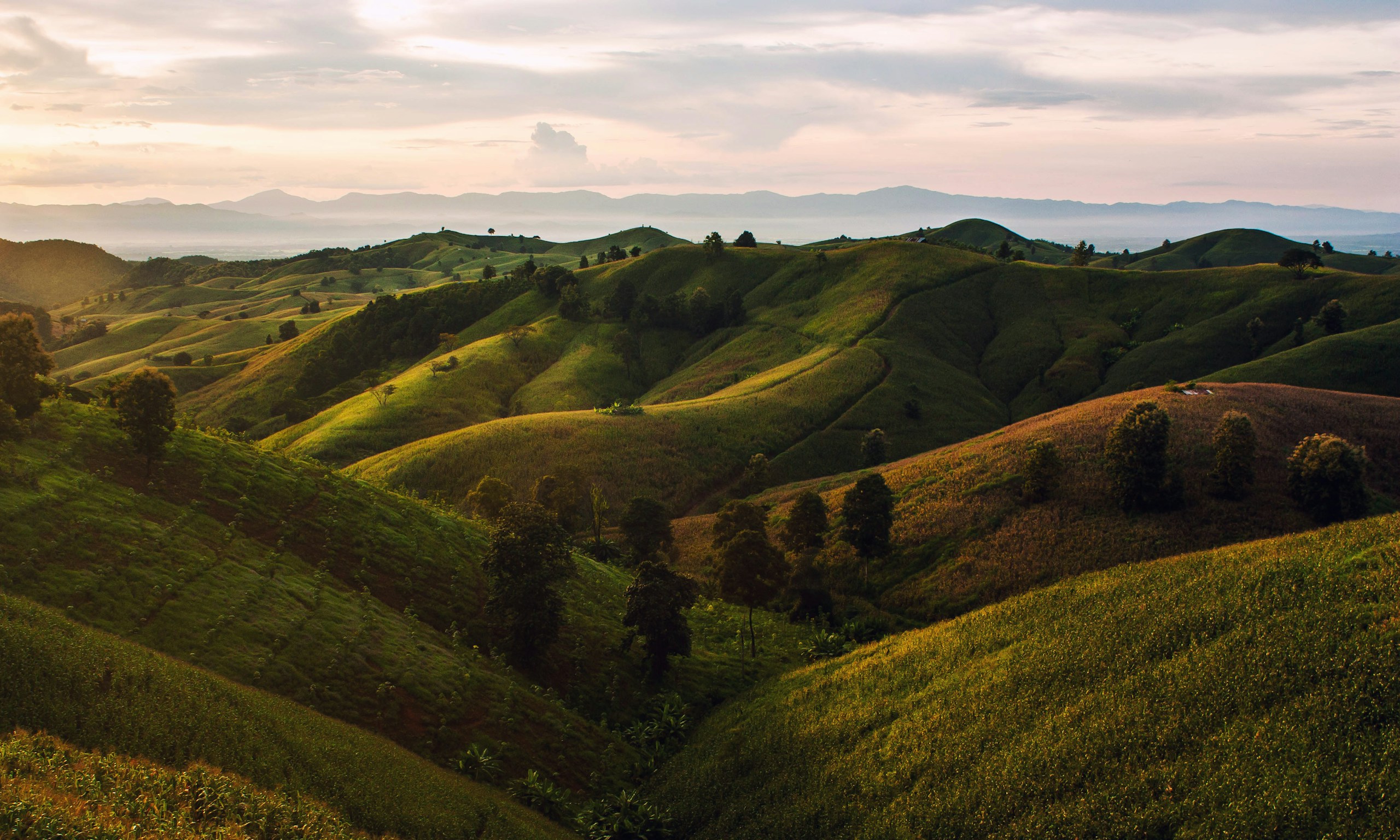 Rolling Green Hills and Mountains at Sunrise HD Wallpaper
