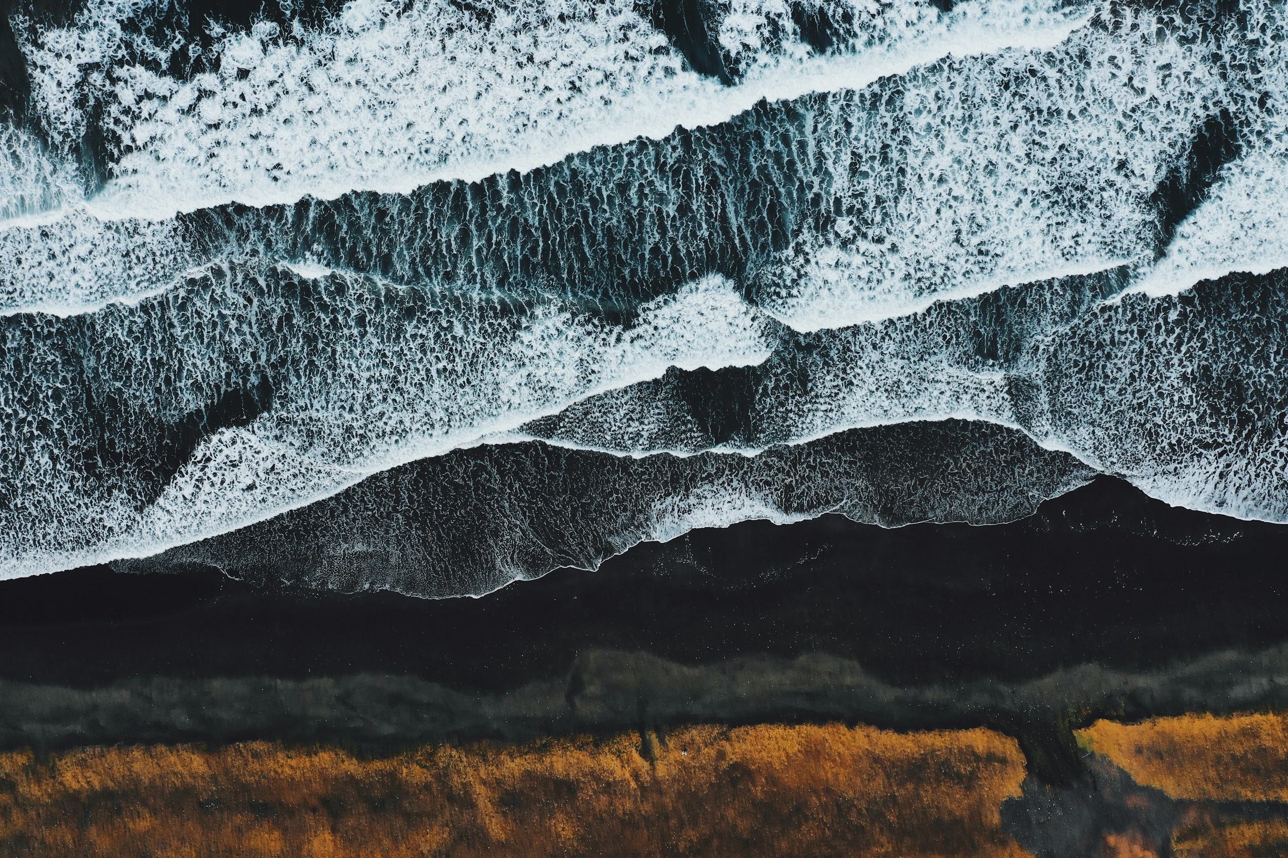 Aerial View of Black Sand Beach in Iceland HD Wallpaper