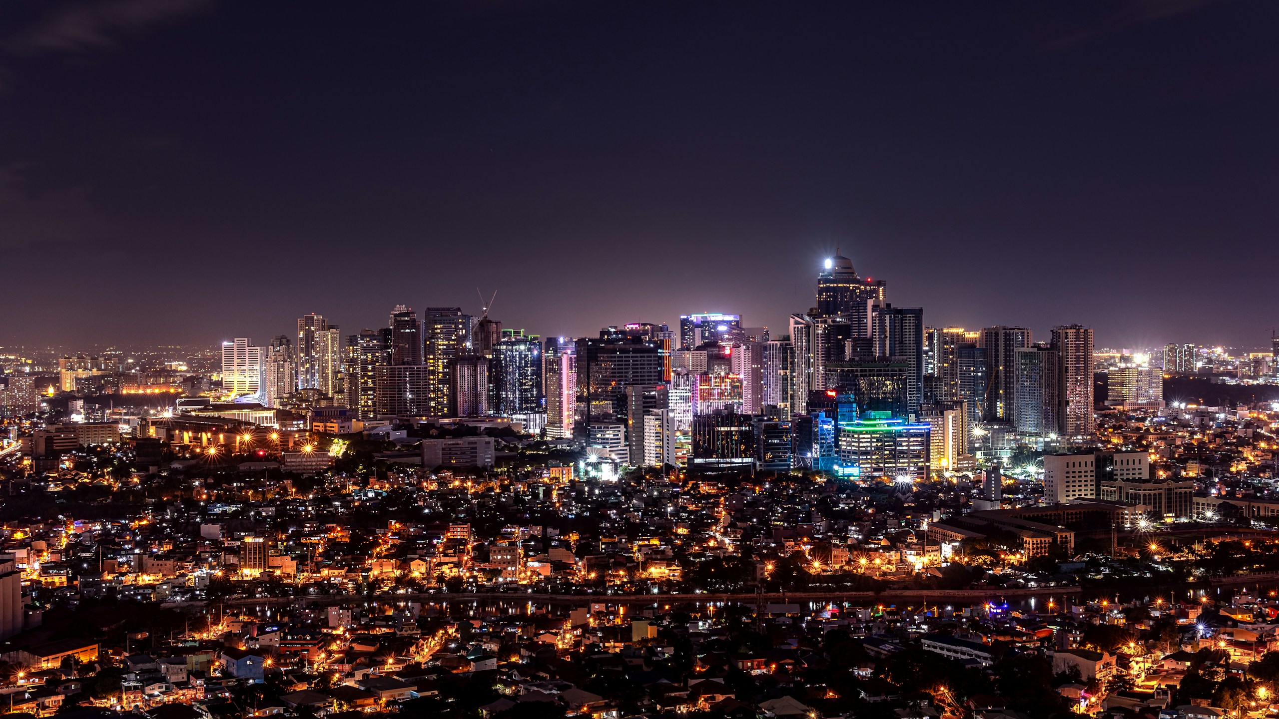 Night Skyline of Makati City with Illuminated Skyscrapers HD Wallpaper