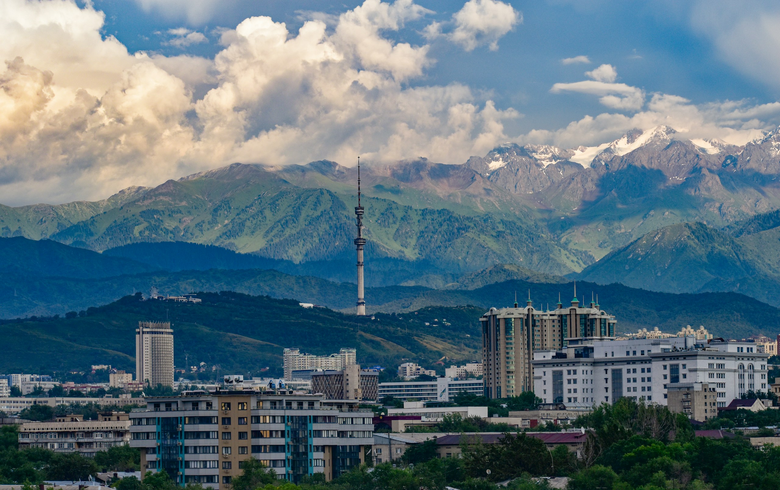 Almaty City Skyline with Tian Shan Mountains HD Wallpaper