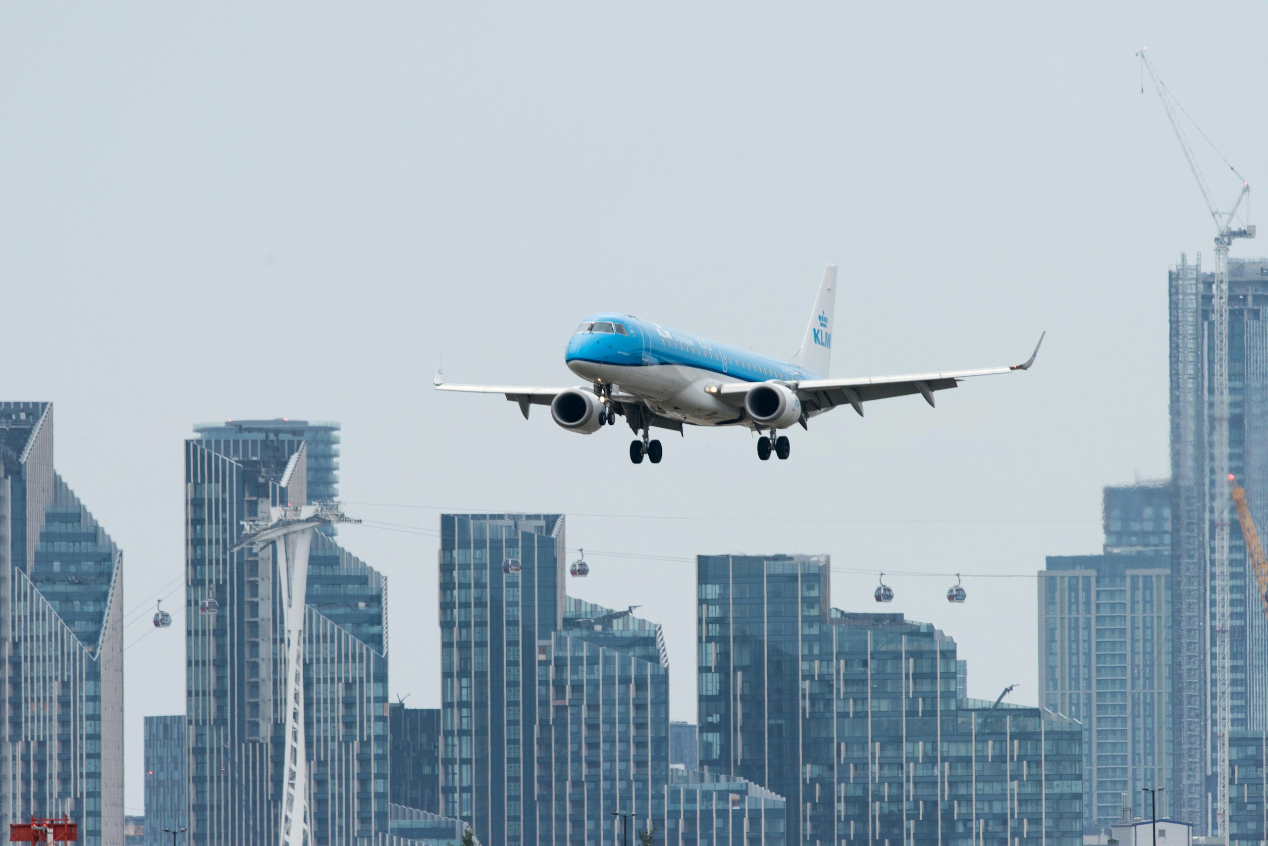 KLM Passenger Plane Flying Over City Skyline HD Wallpaper