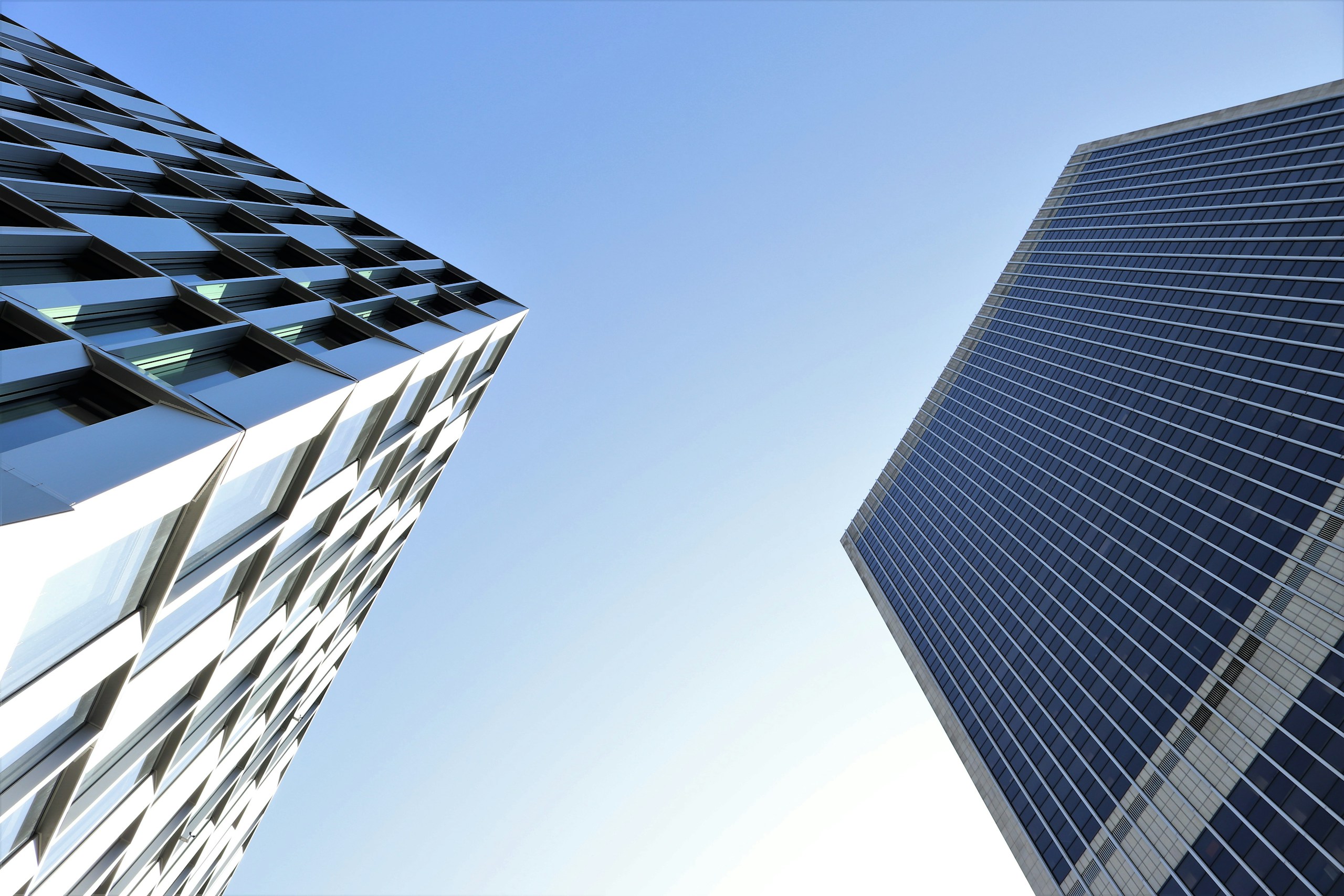 Modern Skyscrapers Against a Clear Blue Sky HD Wallpaper