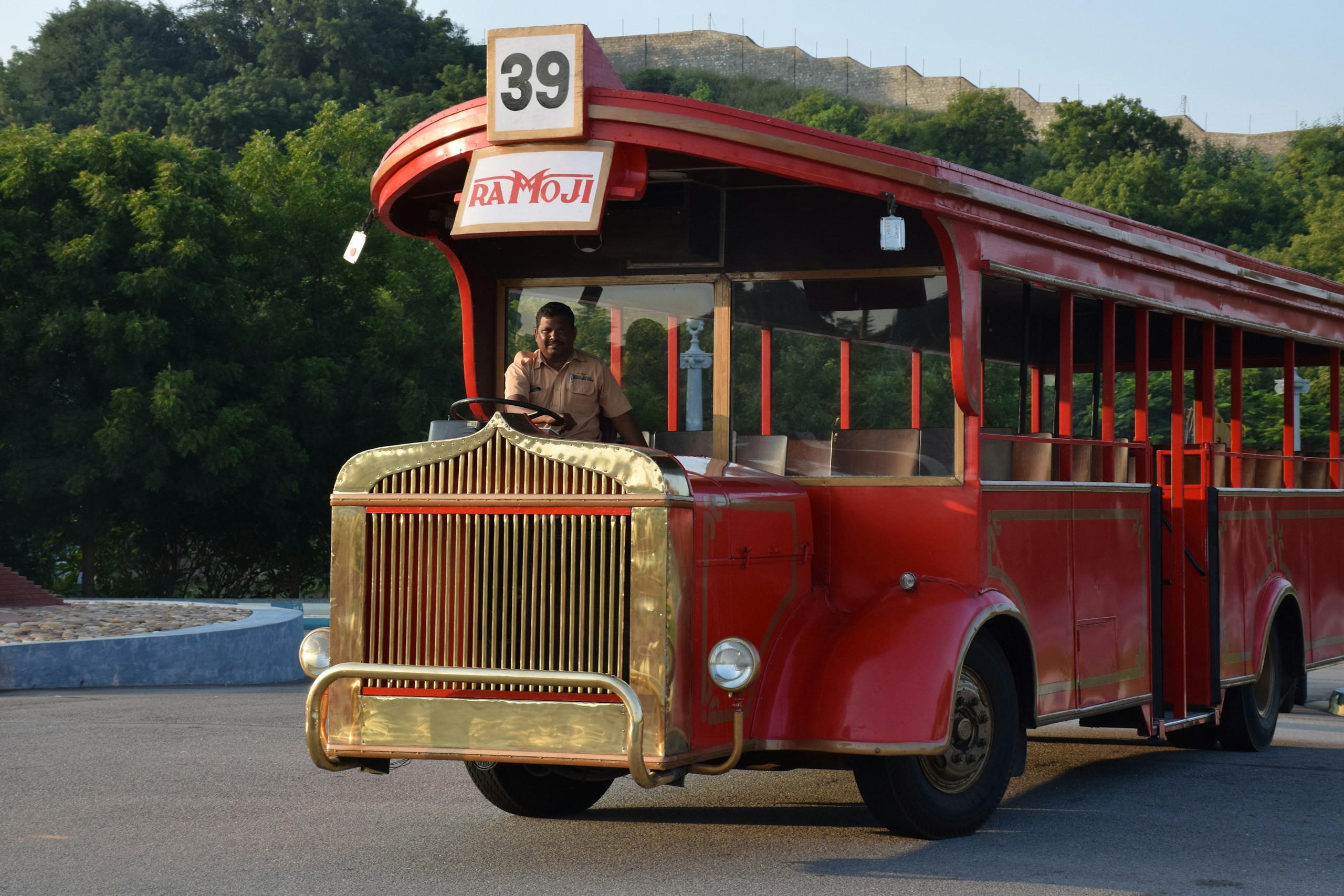 Red Ramoji Film City Tour Bus with Driver HD Wallpaper