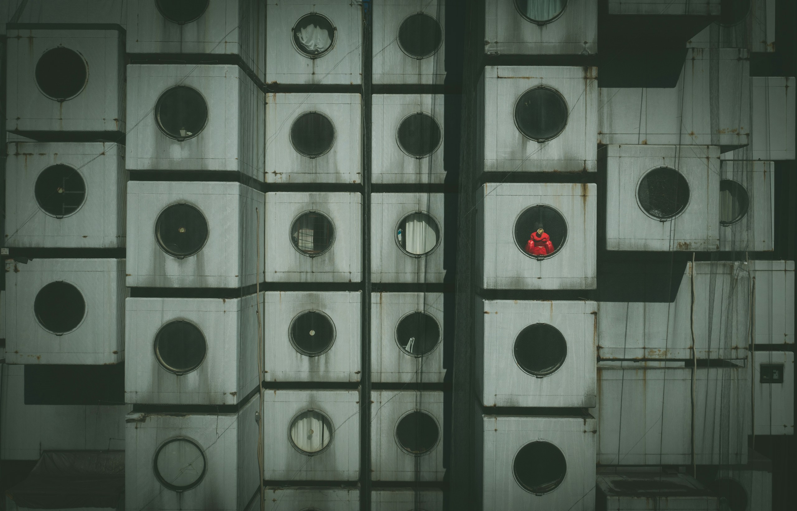 Nakagin Capsule Tower with Person in Red Jacket HD Wallpaper