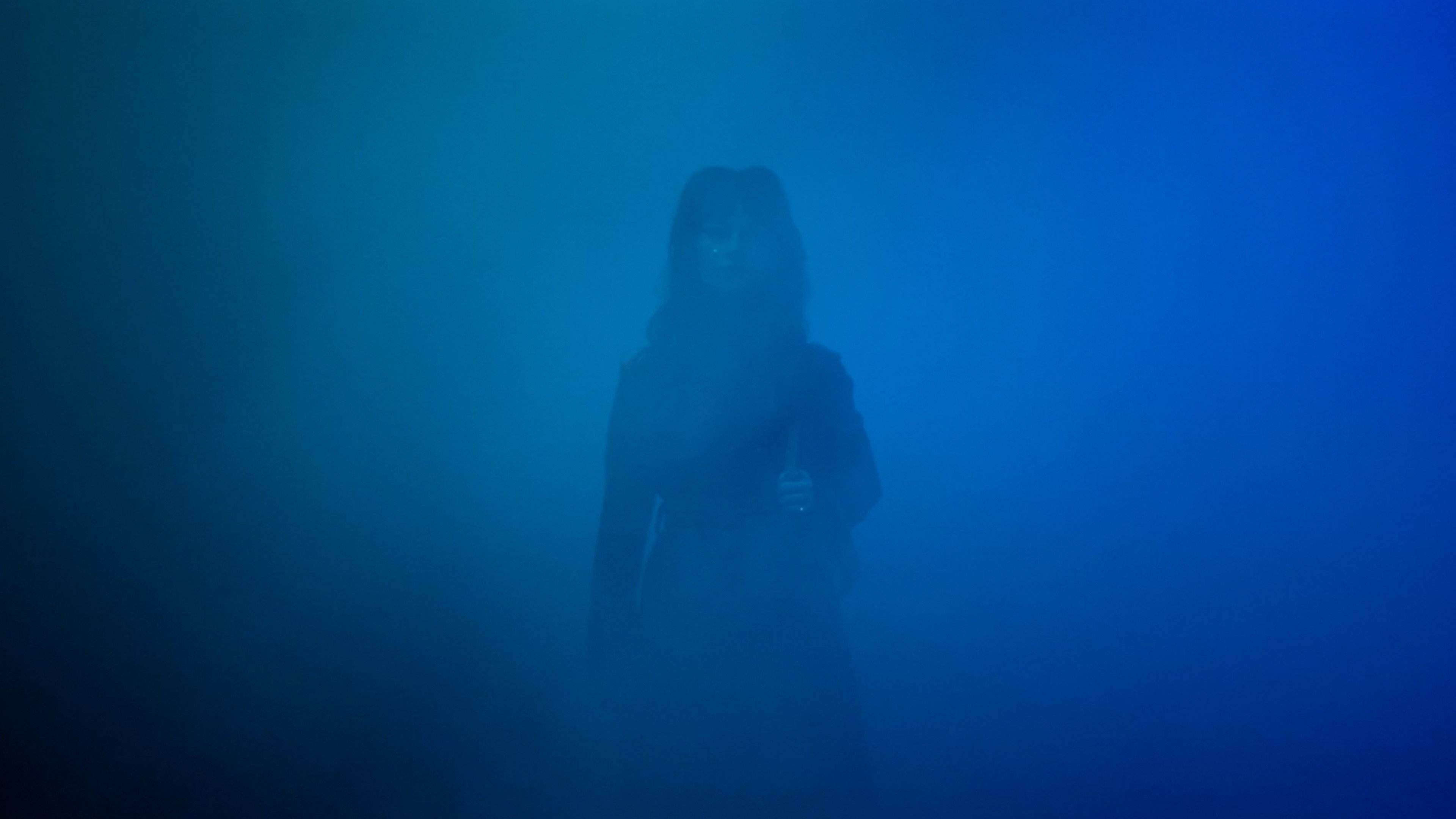 Woman shrouded in blue fog in Her Private Hell HD Wallpaper