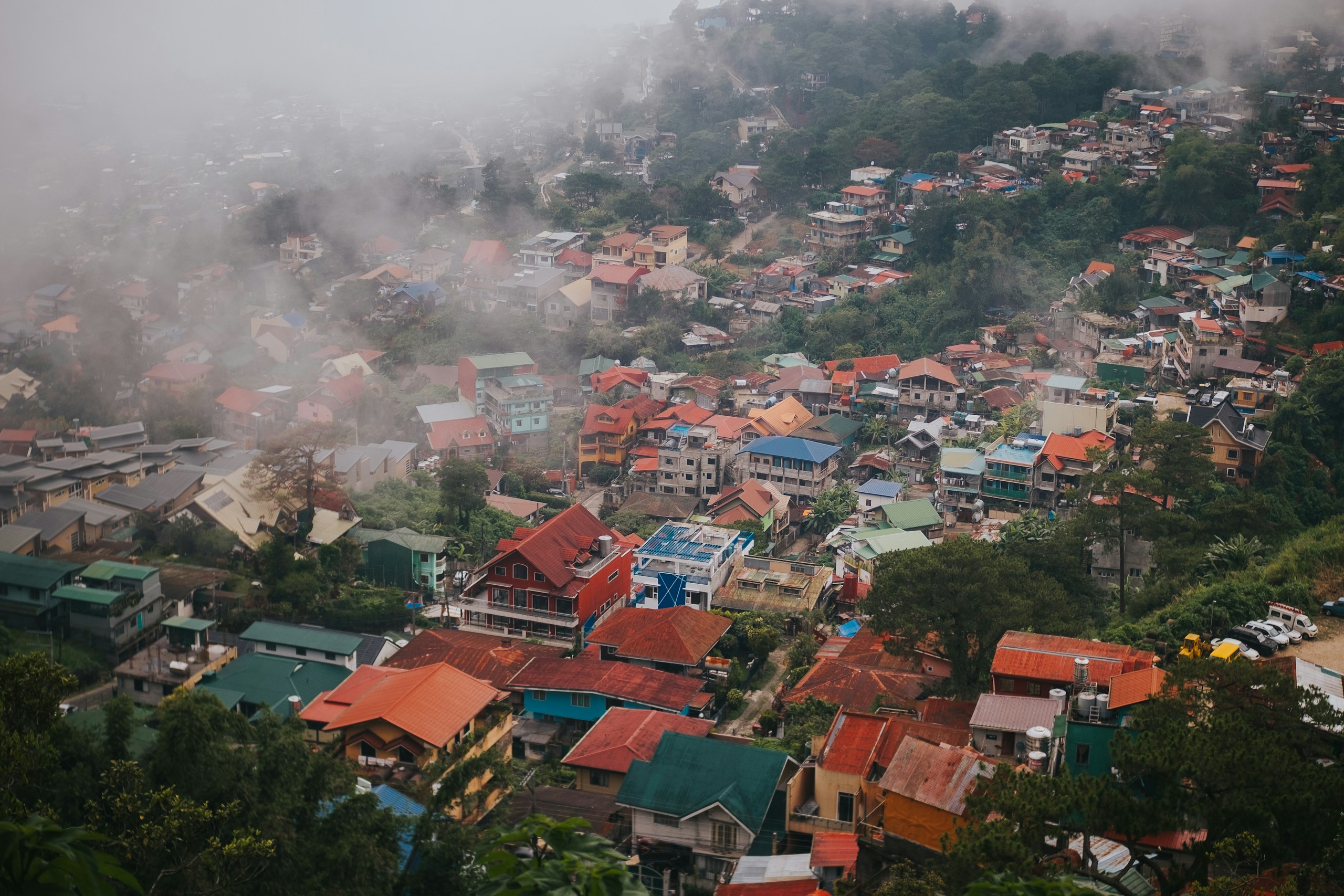 Misty Hillside Town with Colorful Houses HD Wallpaper