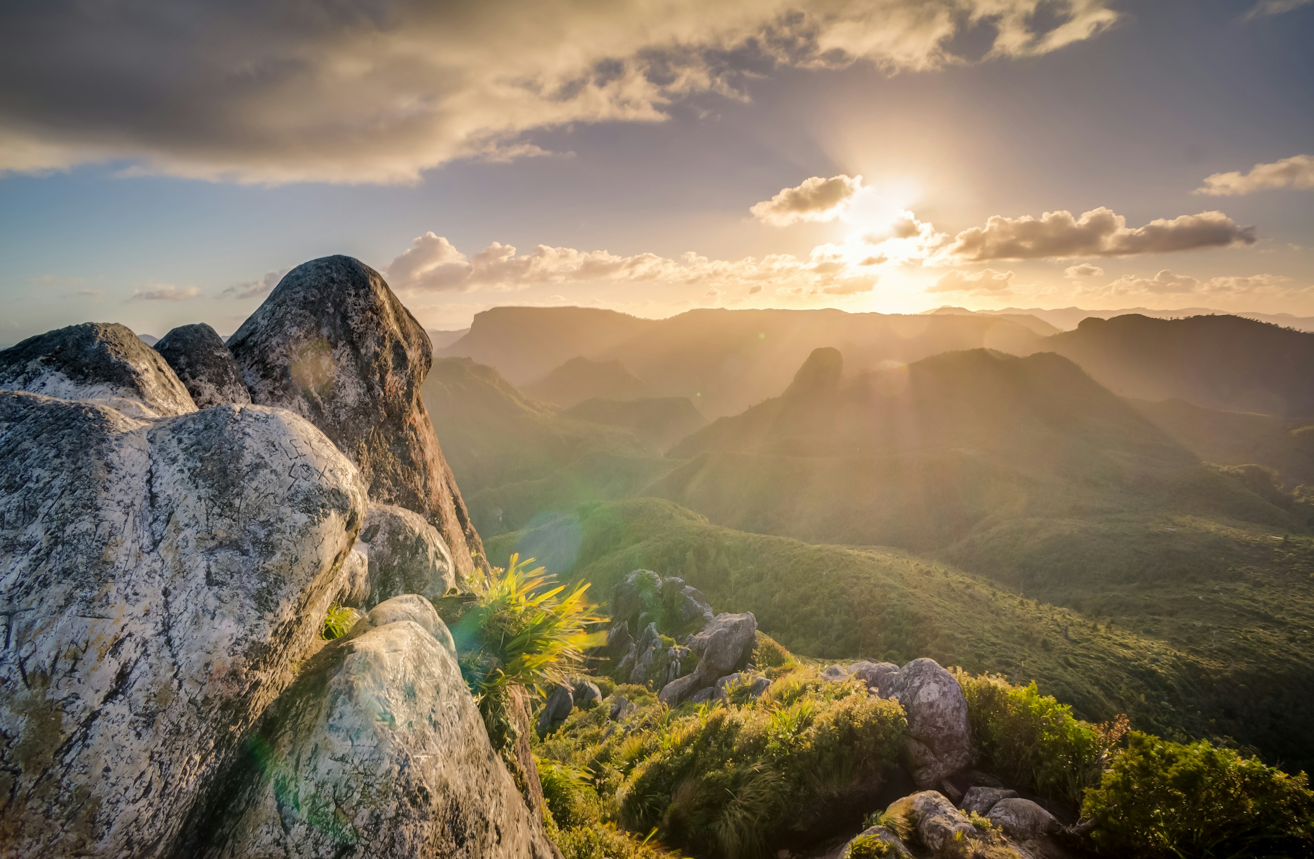 Rocky Mountain Peak Overlooking Green Valleys at Sunset HD Wallpaper