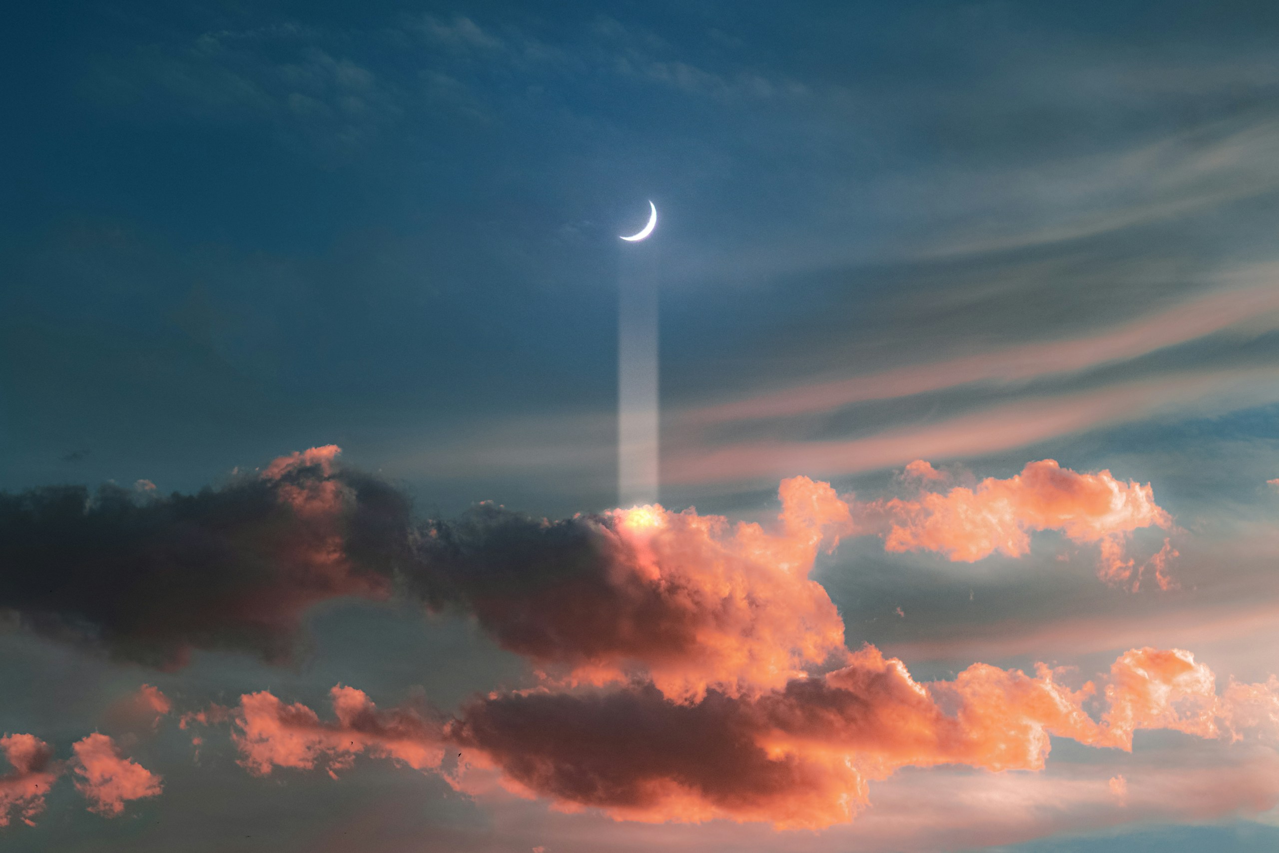 Crescent moon casting a beam of light onto clouds HD Wallpaper