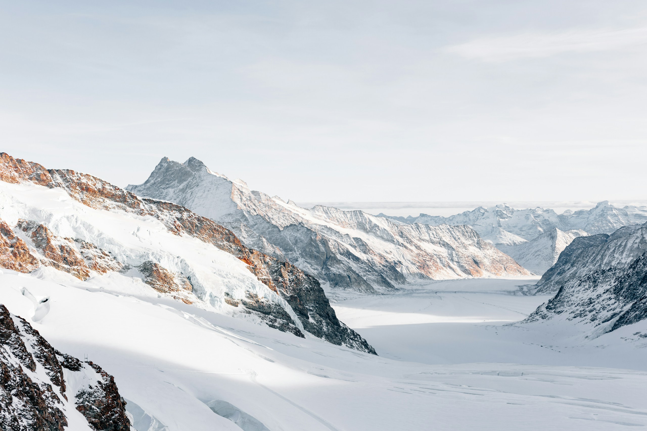Snow-covered Swiss Alps and glacier valley HD Wallpaper
