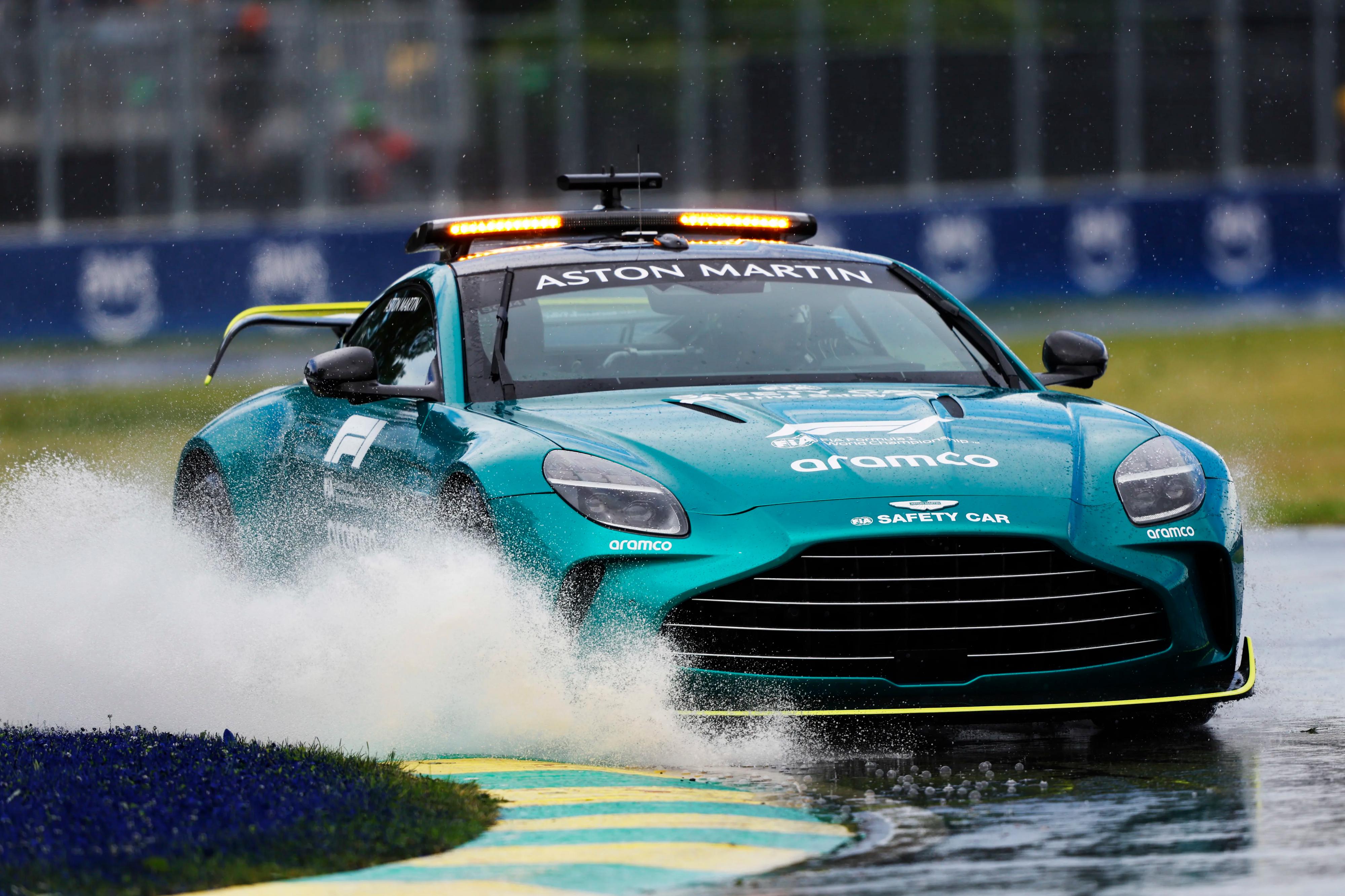 Aston Martin Vantage Formula 1 Safety Car on Wet Track HD Wallpaper