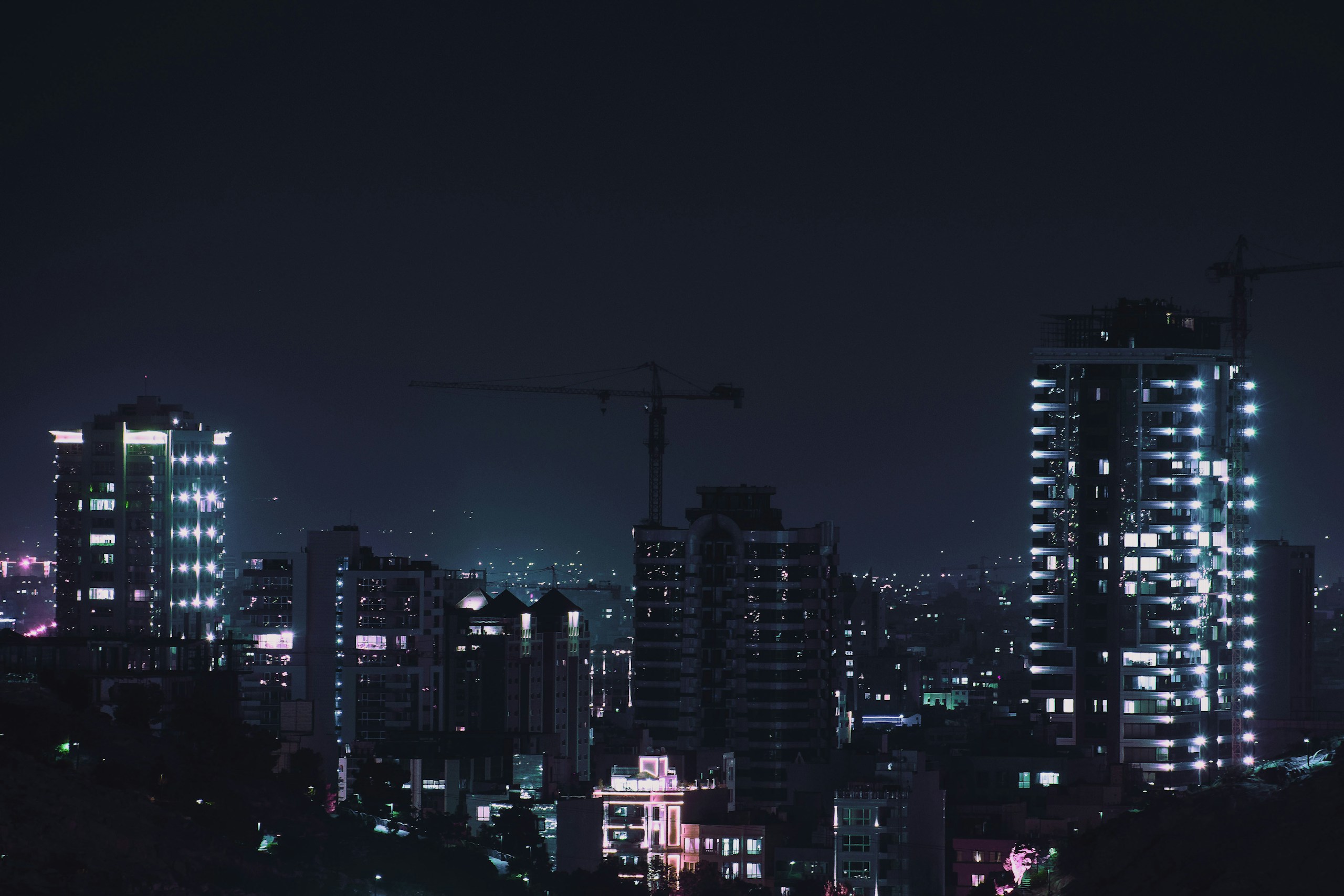 City skyline with high-rise buildings at night HD Wallpaper