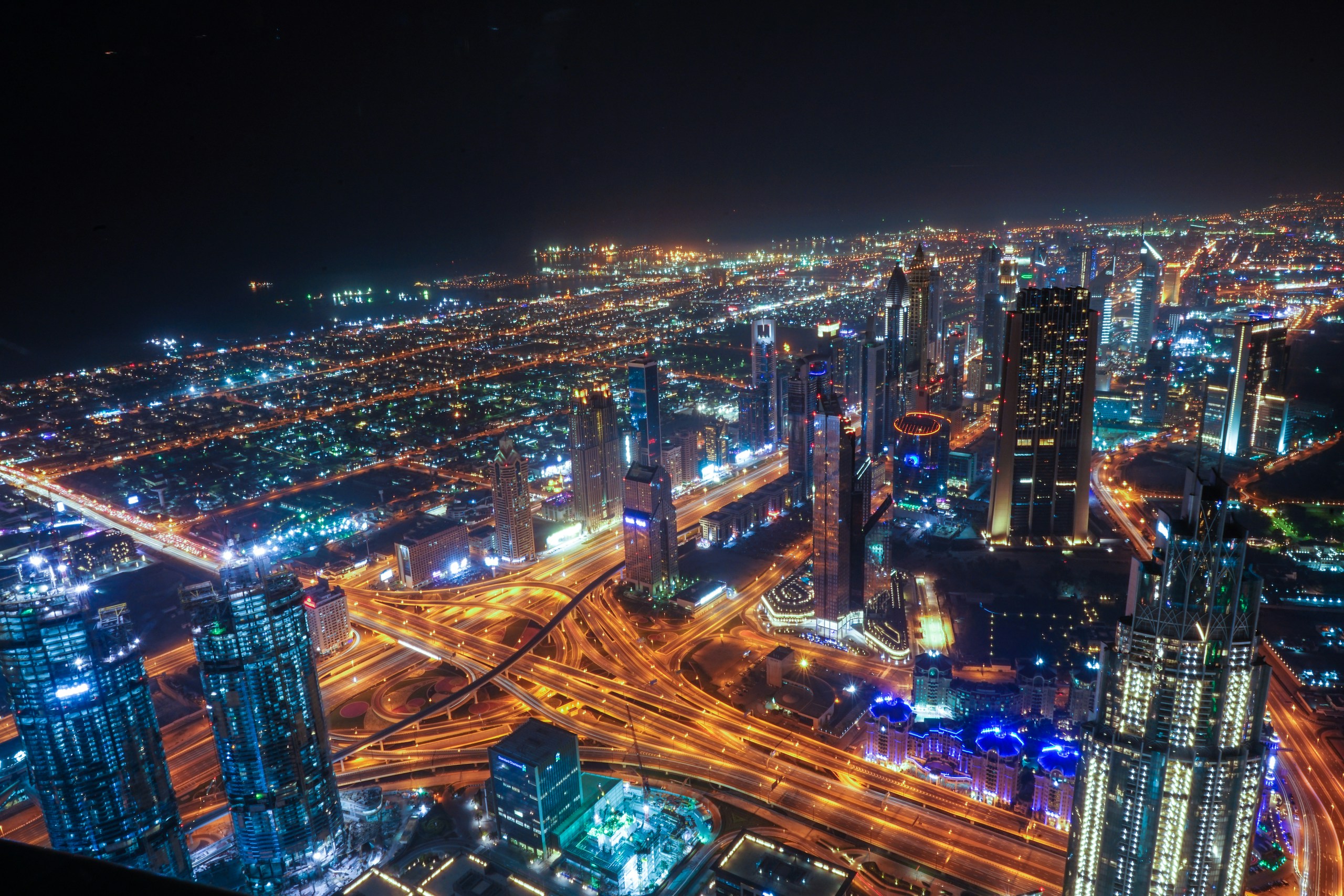 Aerial view of Dubai skyline at night HD Wallpaper