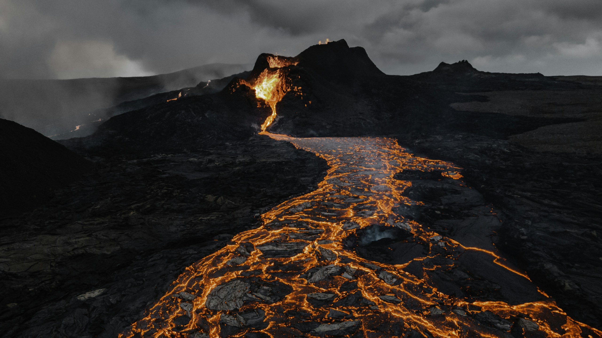 Fagradalsfjall volcanic eruption with glowing lava flow HD Wallpaper