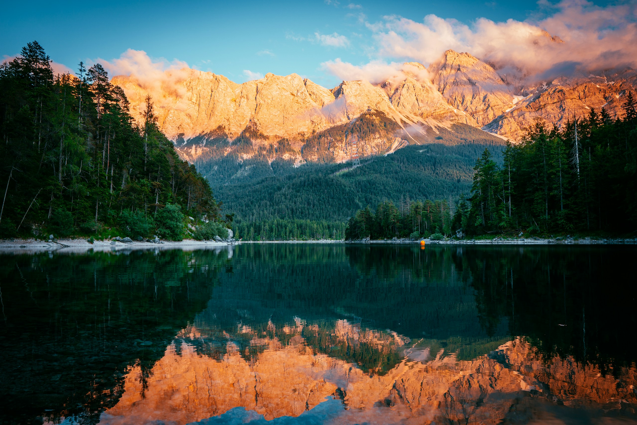 Mountain range reflecting in a calm alpine lake HD Wallpaper