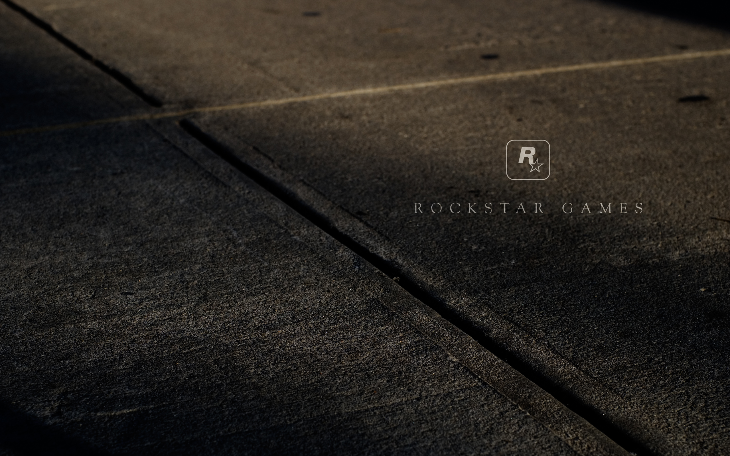 Rockstar Games Logo on Concrete Pavement HD Wallpaper